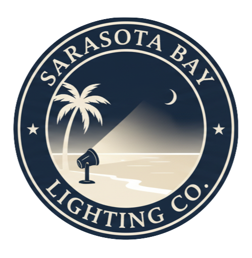 Seal of Sarasota Bay Lighting Co., featuring a beach scene with a palm tree, a lighthouse projecting light, water, a crescent moon, and stars.