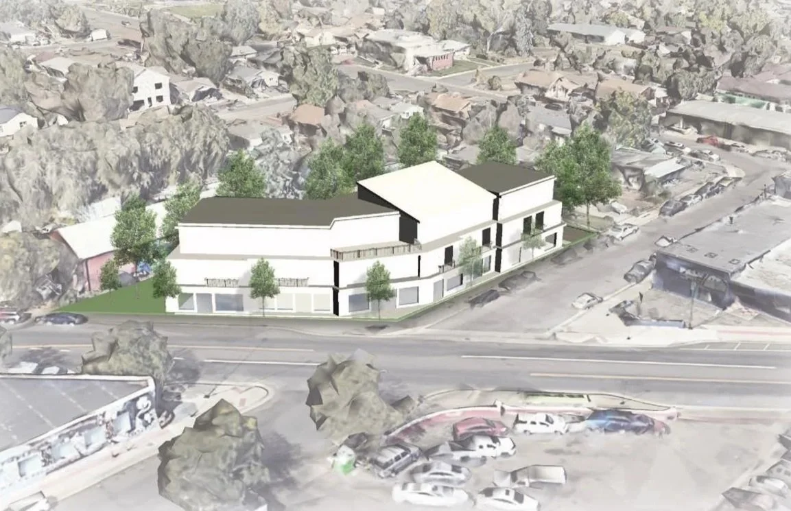 Architectural rendering of a modern mixed-use building with retail space on the ground level and residential units above, situated on a corner lot with trees and parking.