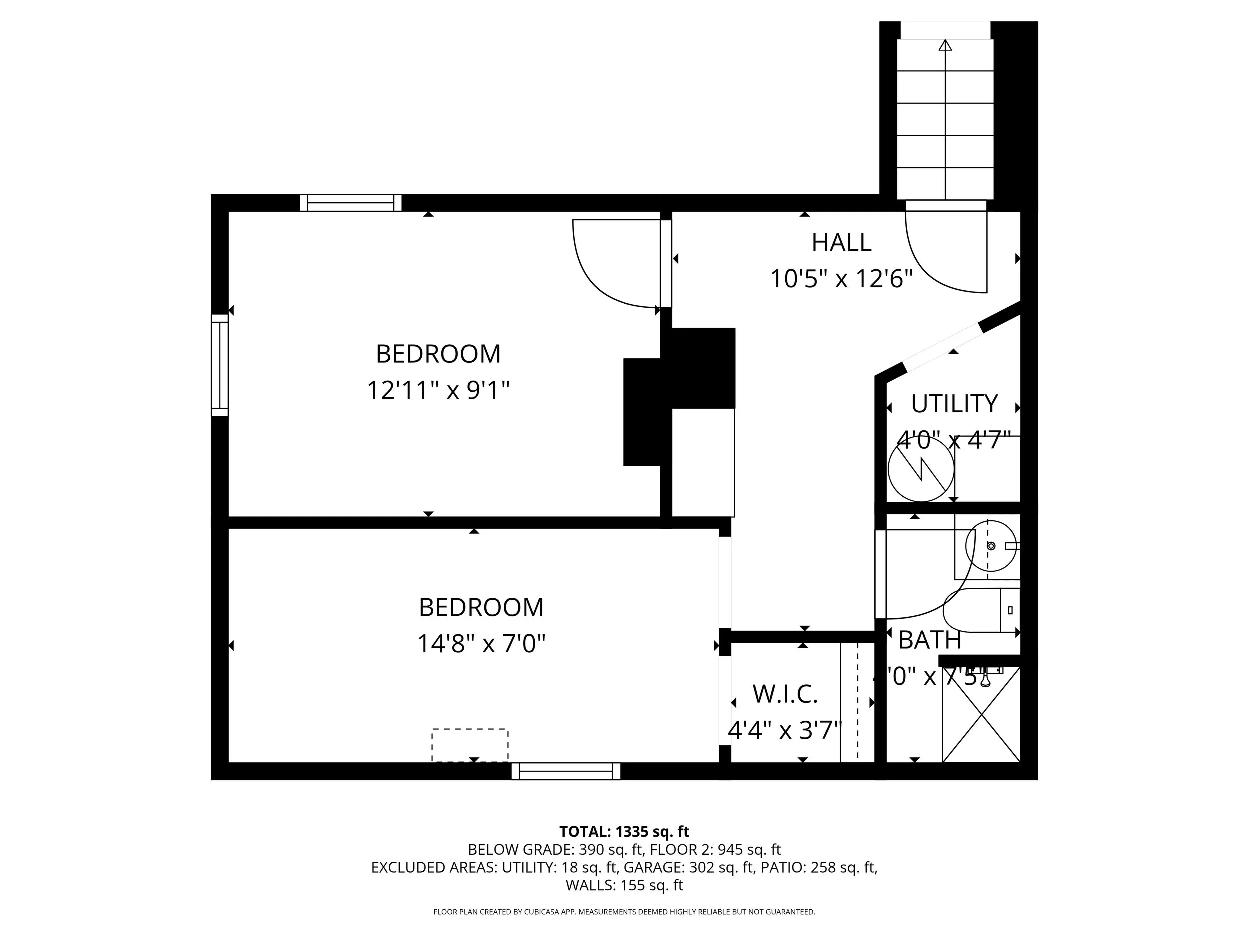 Floor plan of a house showing two bedrooms, a hall, a utility room, a bathroom, and a walk-in closet with room measurements.
