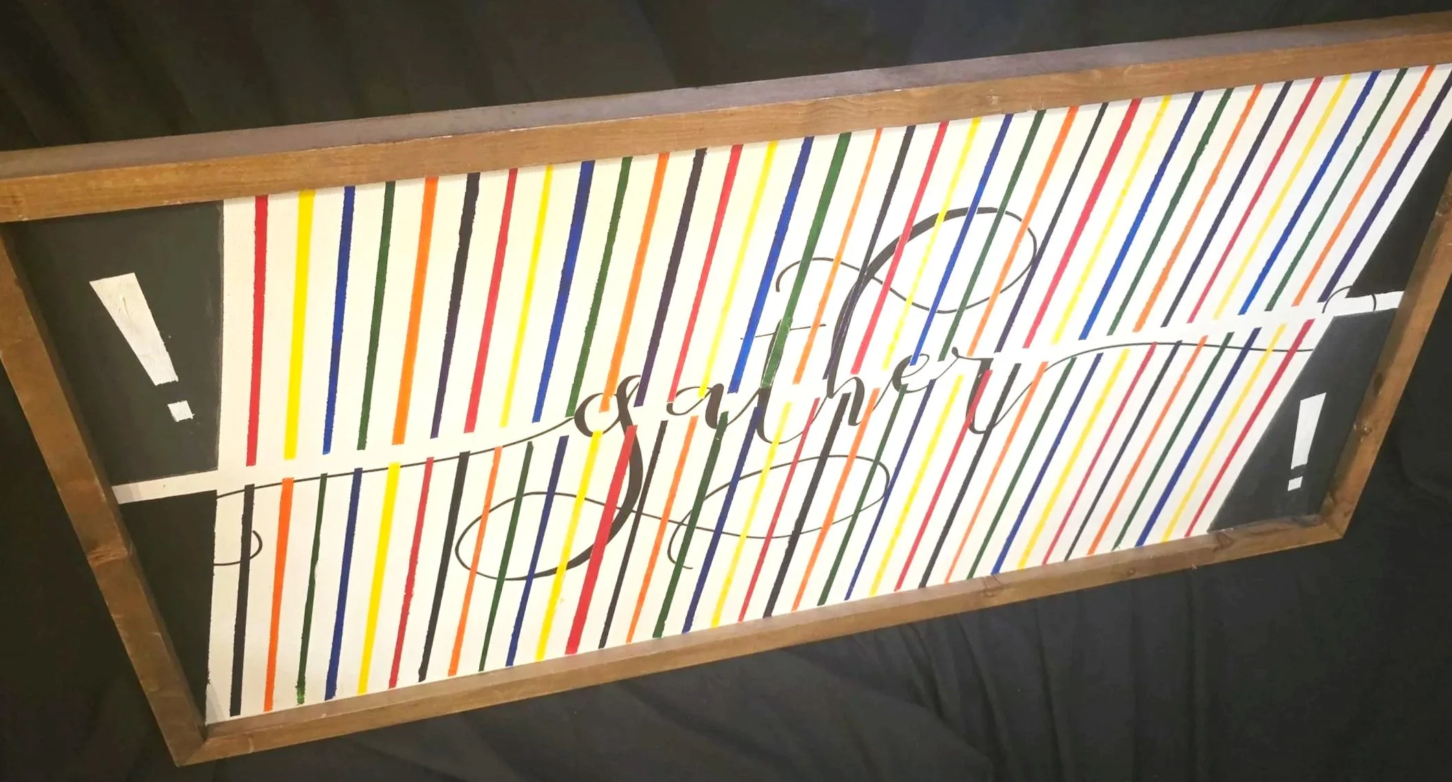 Reworked wall art by Andrew Hall with bold color and clean shapes, photographed casually.