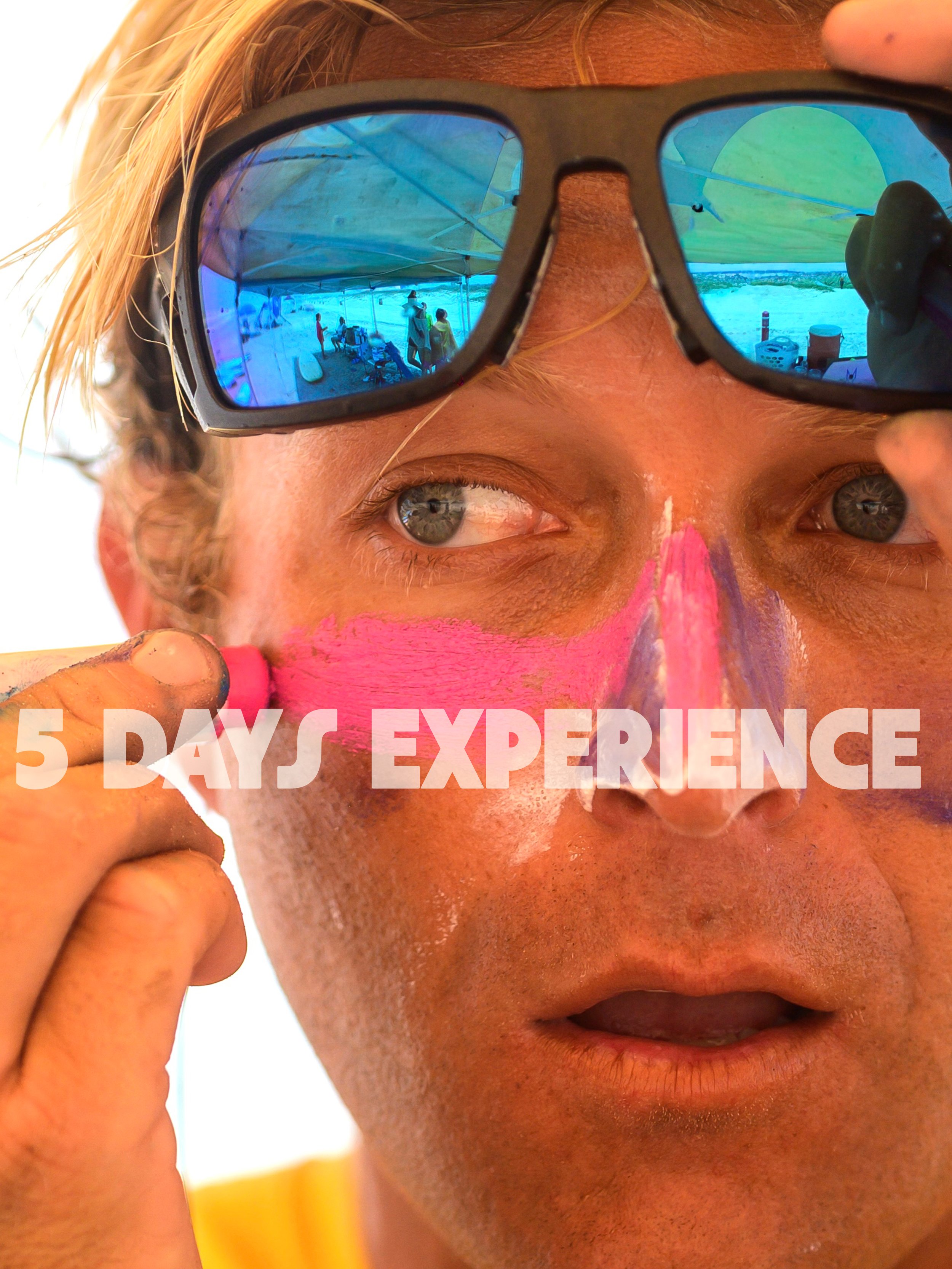 Close-up of a person with face paint, wearing sunglasses, looking in the distance, putting pink sunscreen. Reflected in the sunglasses is a beachside setting with people, tents, and beach chairs. Text on the image reads '5 Days Experience.'