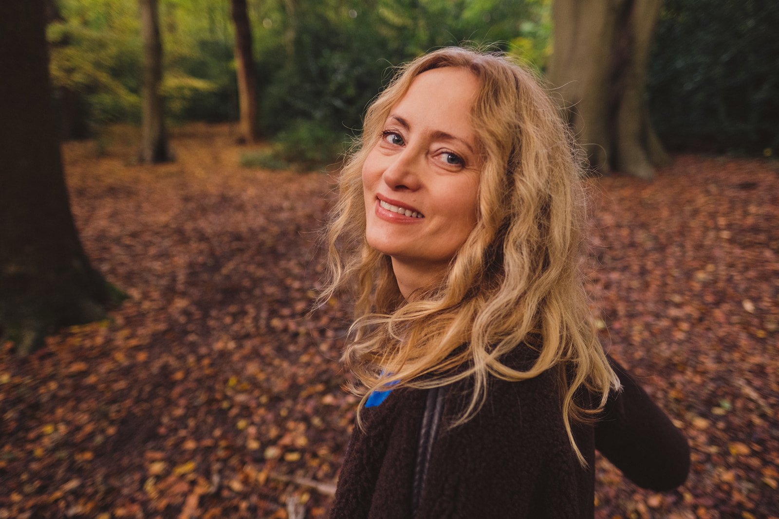 Kasia Farrar, breathwork and bodywork practitioner, photographed in Highgate Woods, North London.