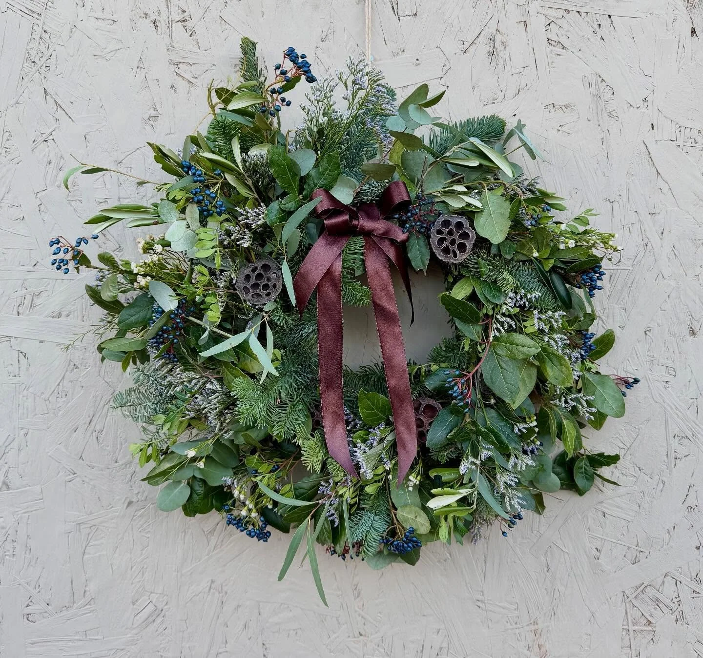 🌲 Festive Wreath No. 3 🌲
A beautifully wild and natural design, Winter Forage is crafted with a mix foliage and viburnum berries, waxflower and limonium. 

The scent of eucalyptus and textured greenery create a full, woodland feel, while clusters o