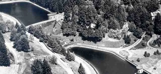 Washington Park Reservoirs - Black-and-white aerial photo of two Washington Park reservoirs and winding roads nestled within dense forest