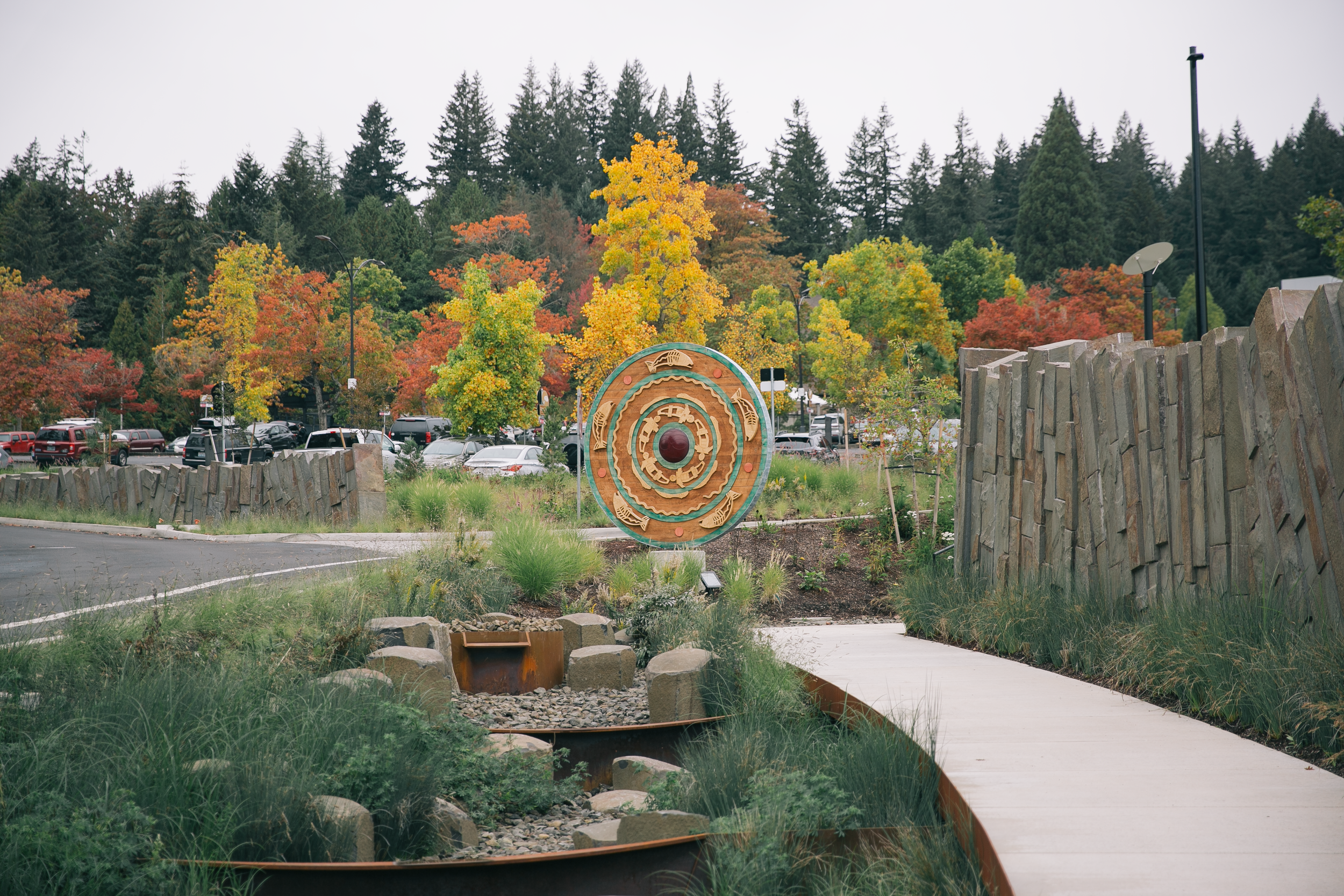 The south entrance to Washington Park features a curved concrete pathway that goes around an intricate metal sculpture near Parking Lots A, B & C.