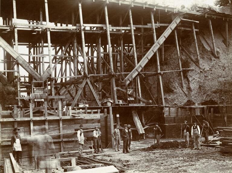  A historic black-and-white photo of Washington Park’s reservoir under construction in its early years. 