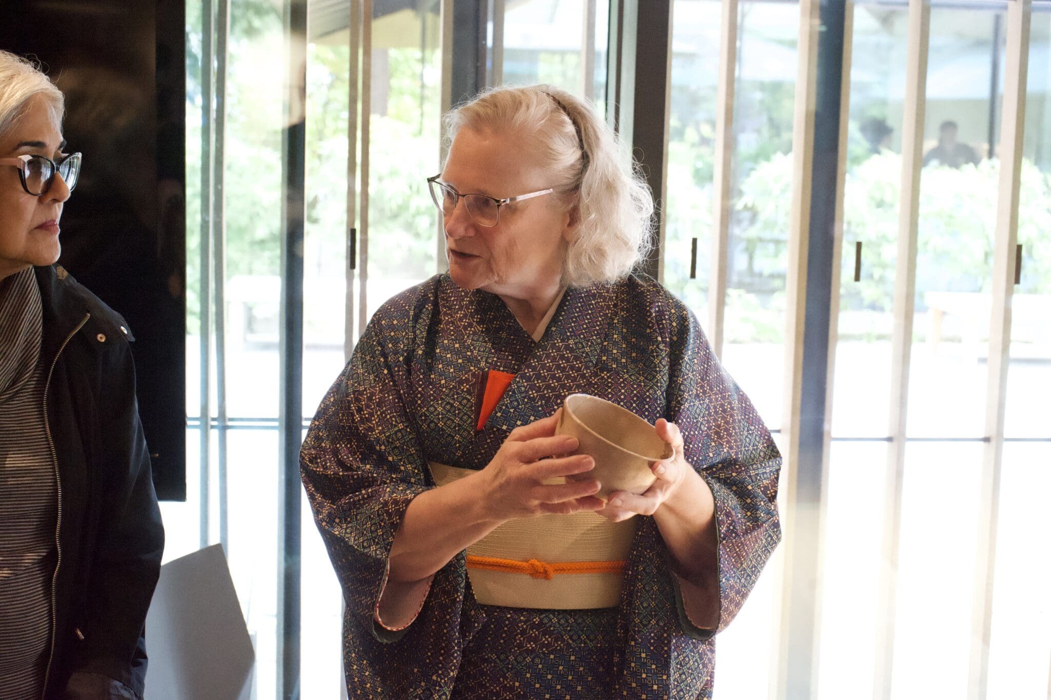 A practitioner holds a bowl of matcha during the Chado tea demonstration. 
