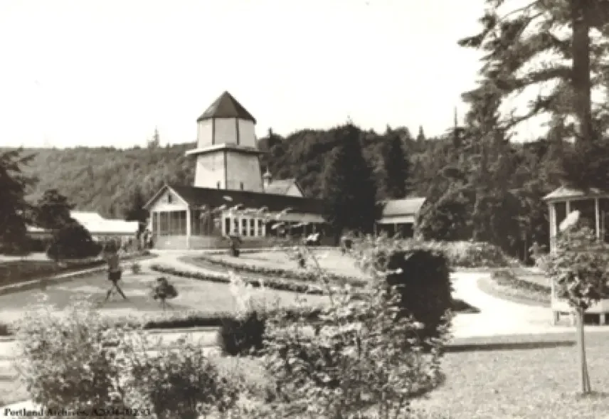 Black-and-white photo of City Park facilities circa 1902, showing a park building with an octagonal tower, gardens, and surrounding trees