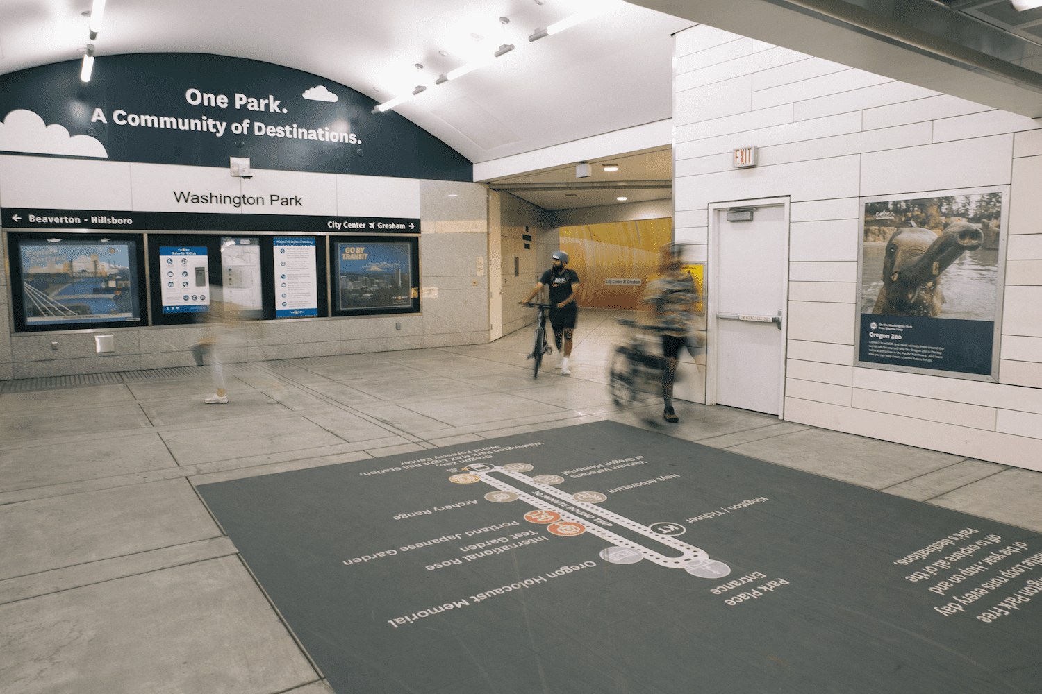Washington Park MAX Light Rail station interior showing platform signs and a floor map of nearby park attractions including Oregon Zoo, Hoyt Arboretum, and Portland Japanese Garden