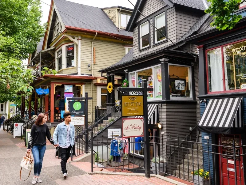 Colorful boutiques and storefronts lining NW 23rd Avenue in Portland’s Nob Hill shopping district.