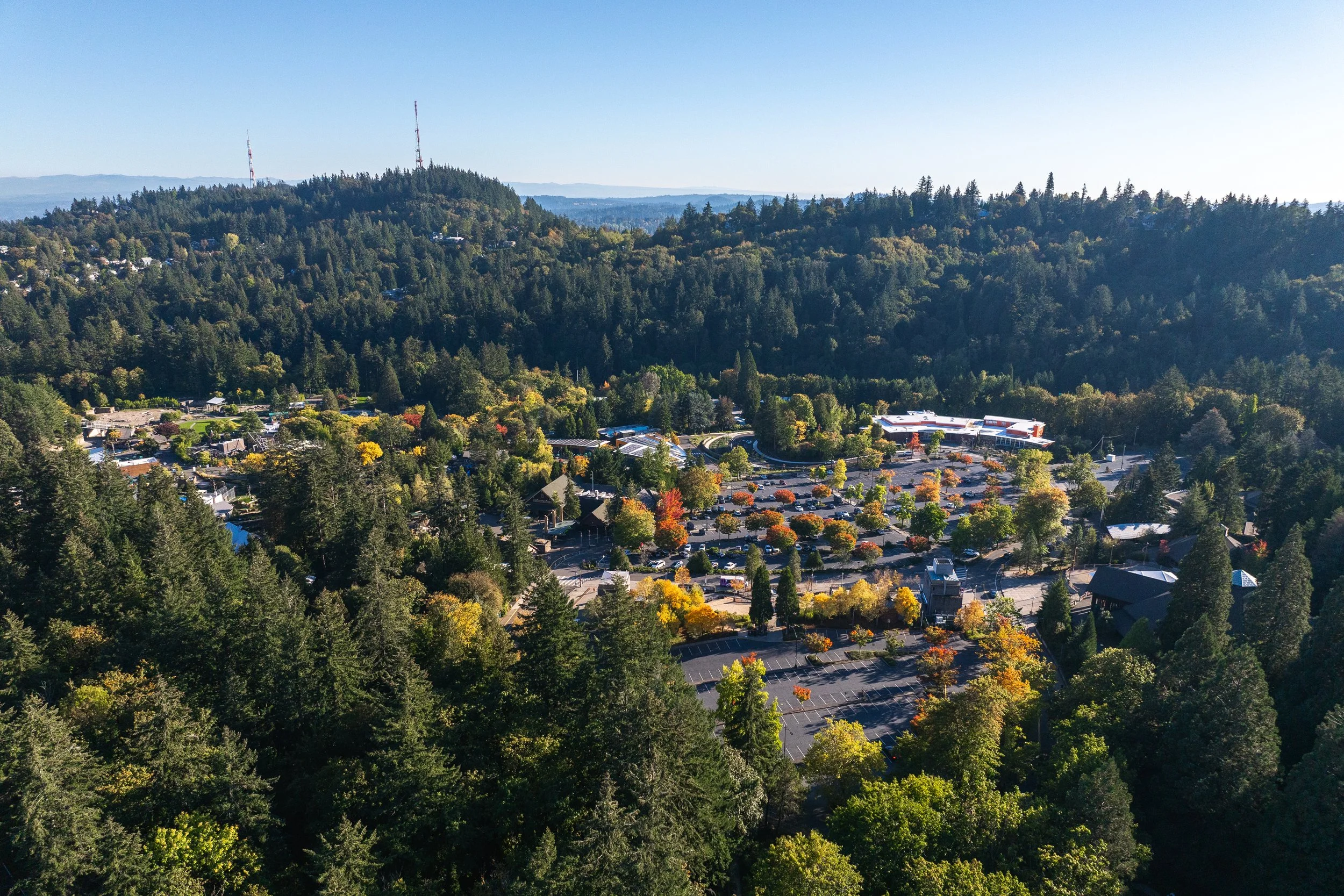 Aerial view of a Washington Park parking lot, next to current parking rate information.