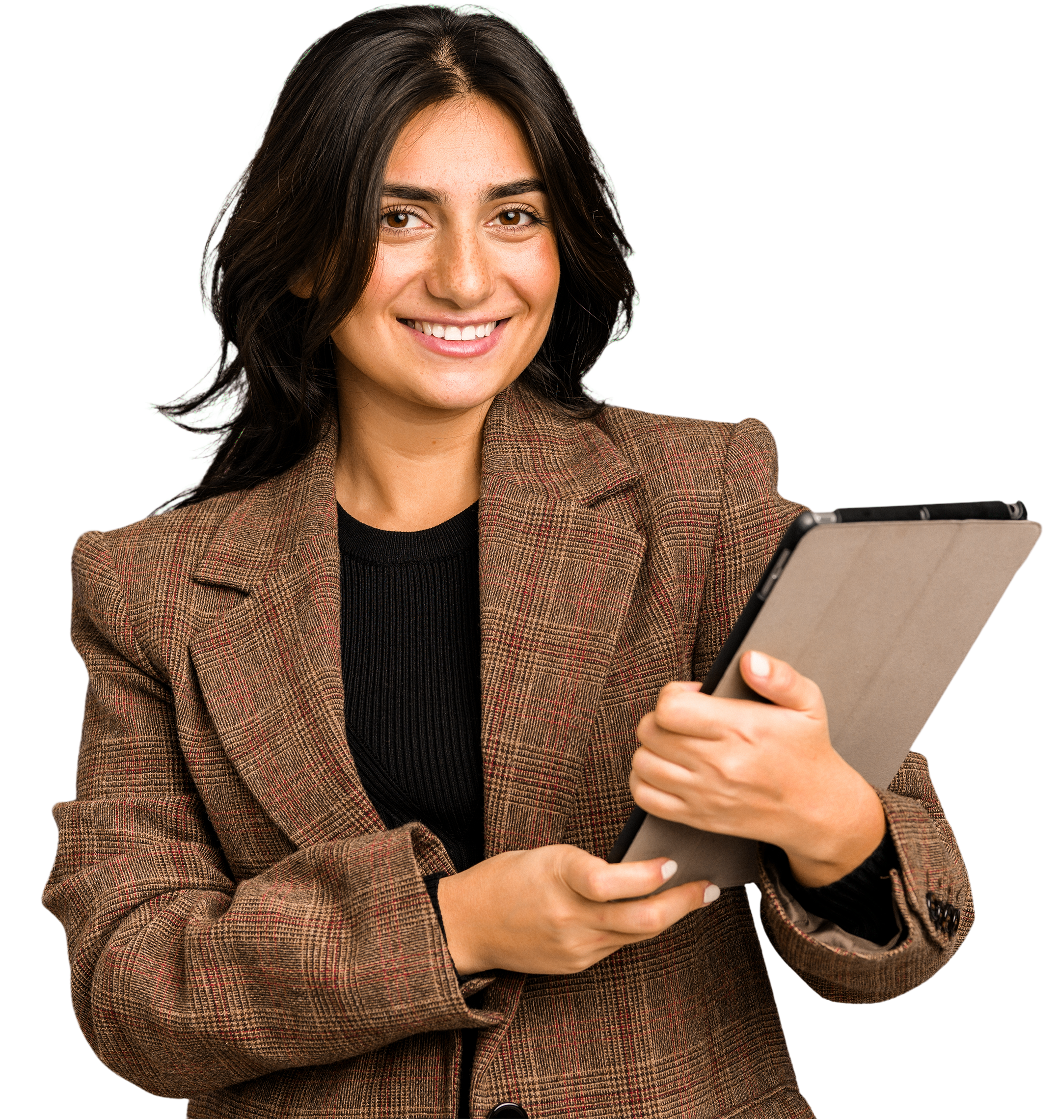 A woman with dark hair smiling and looking at a tablet in her hands, wearing a brown plaid blazer over a black top.