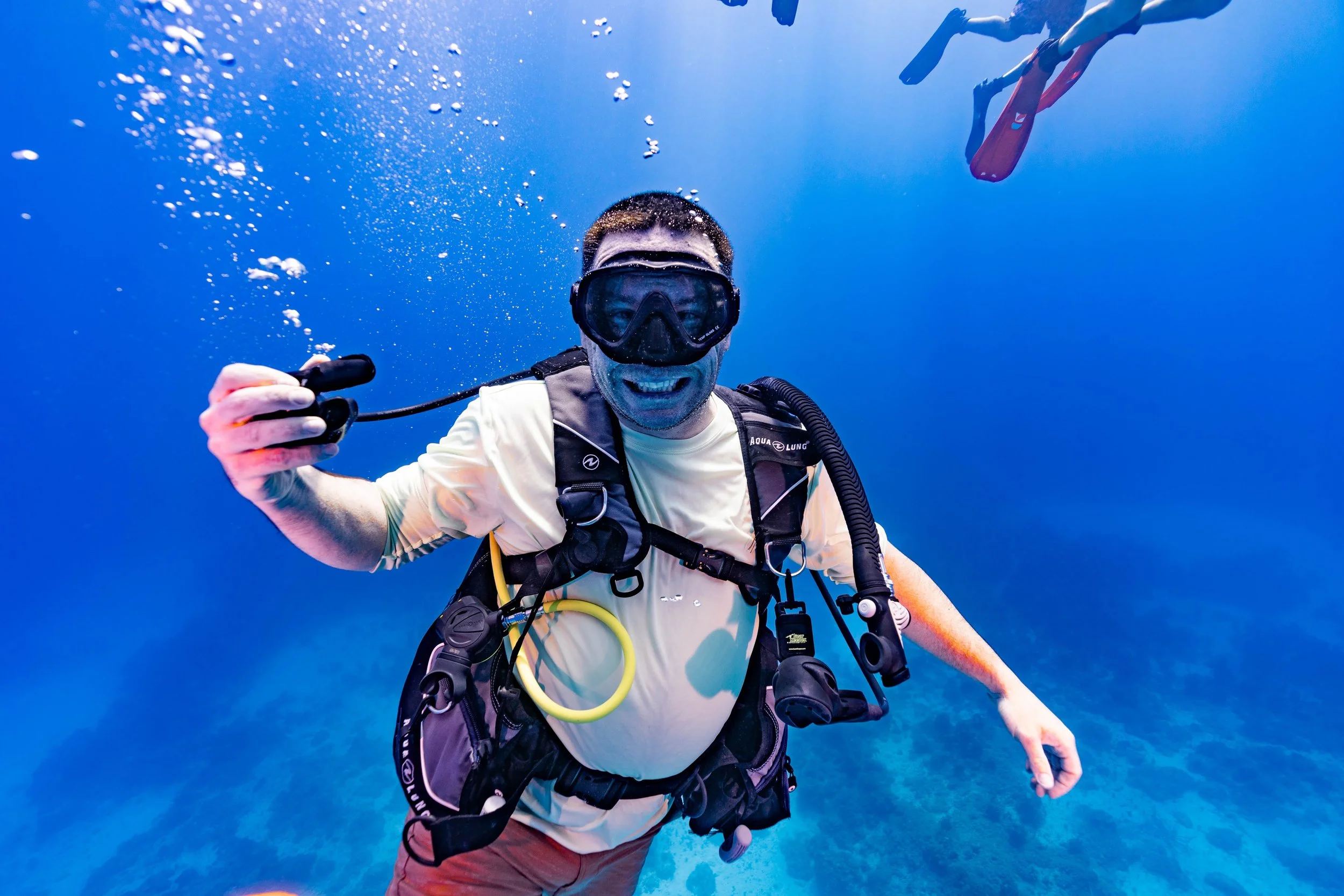 Man smiling while scuba diving