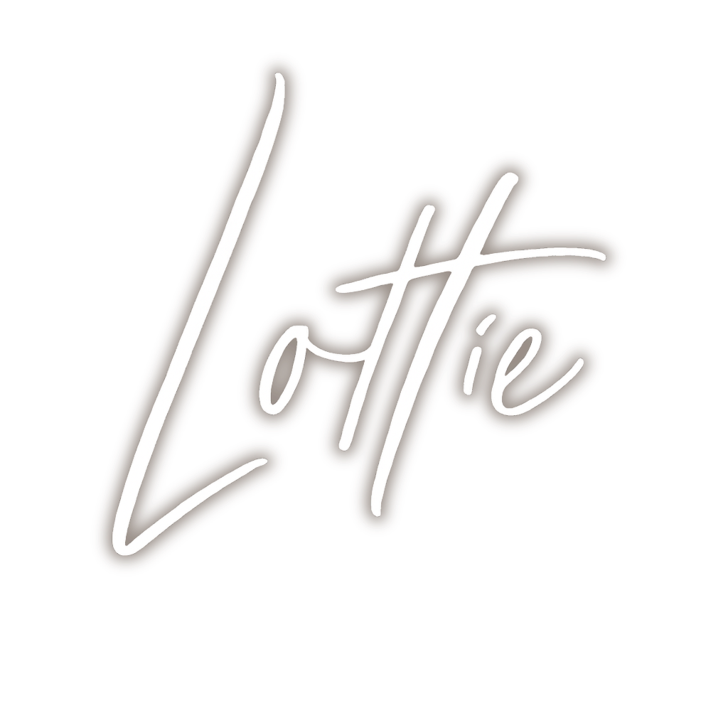 Wedding Photographer logo "Lottie" written in cursive script.