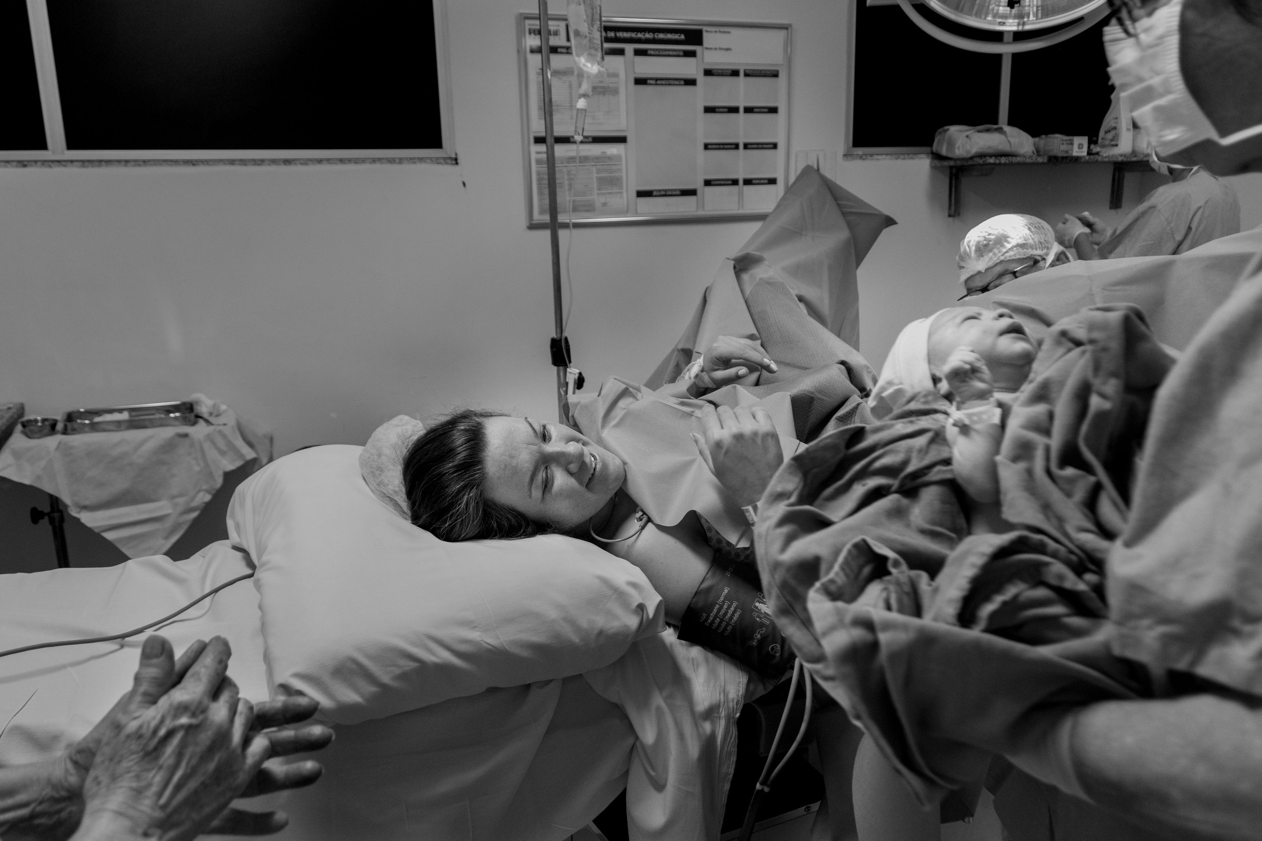 Woman meeting her new baby after a birth with epidural