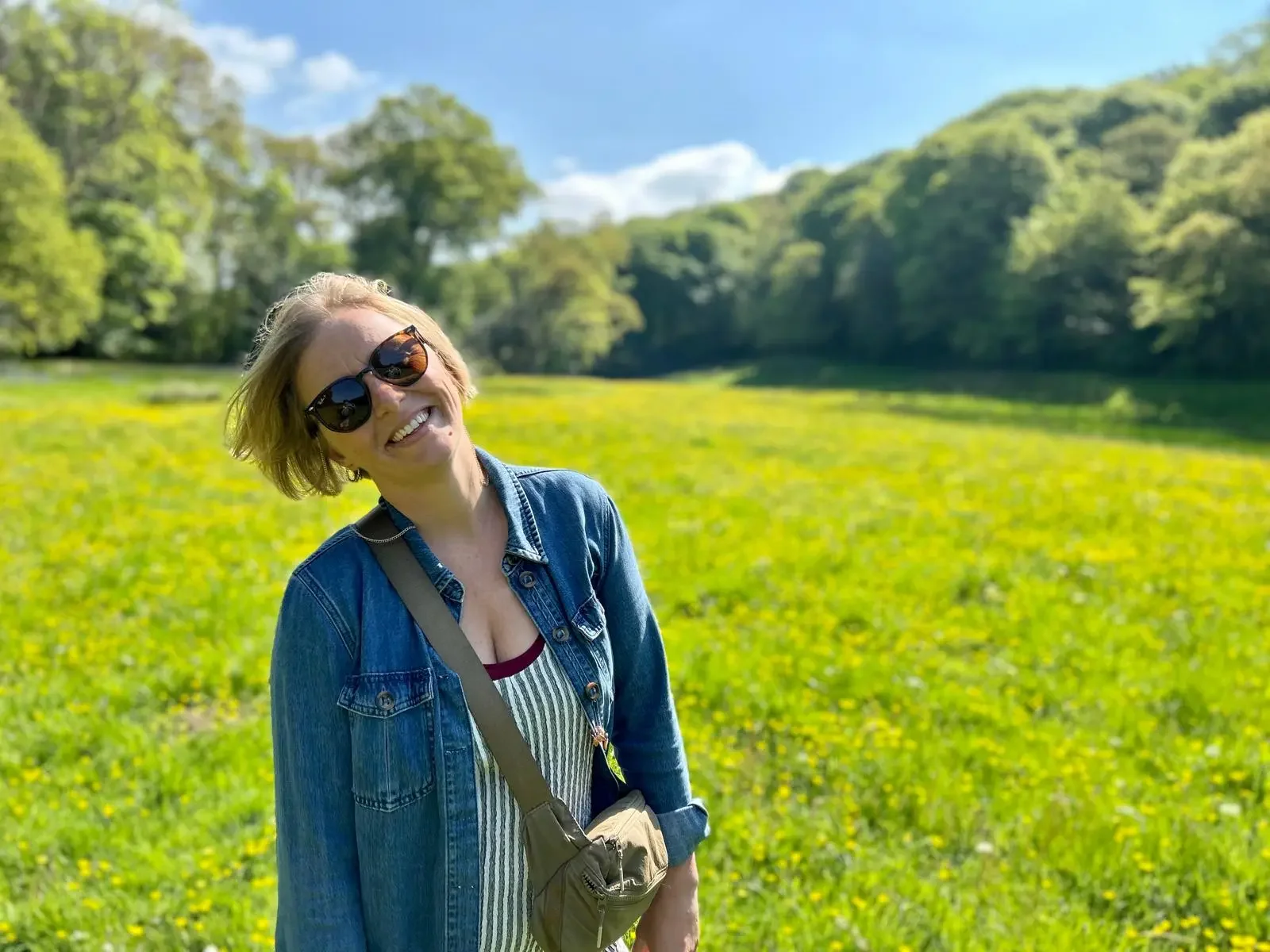 Jem, founder of Bright Births, smiling outdoors in a sunny field — birth preparation educator on Sydney's Northern Beaches