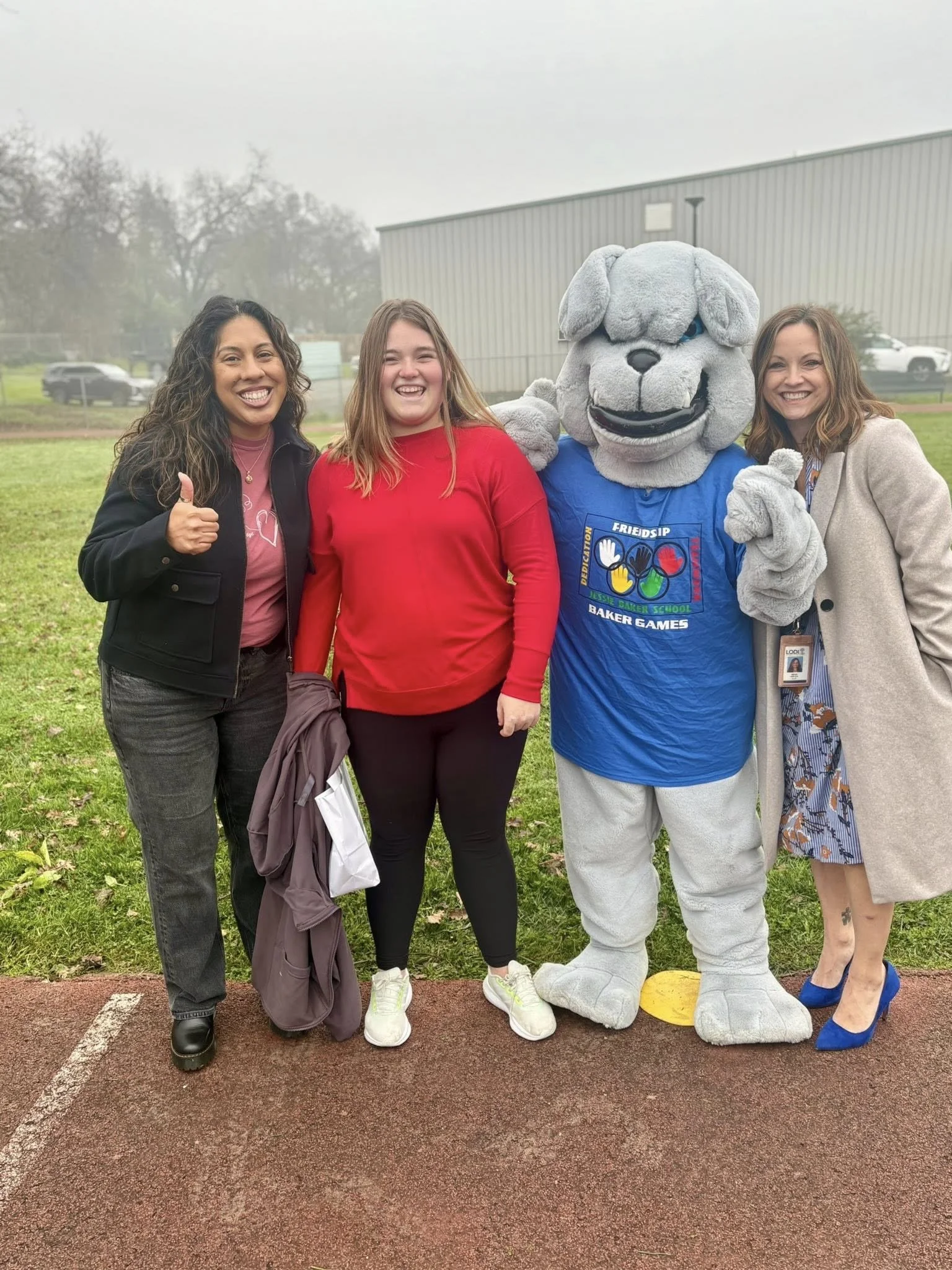 Delia Baulwin with a family at Jessie Baker School.