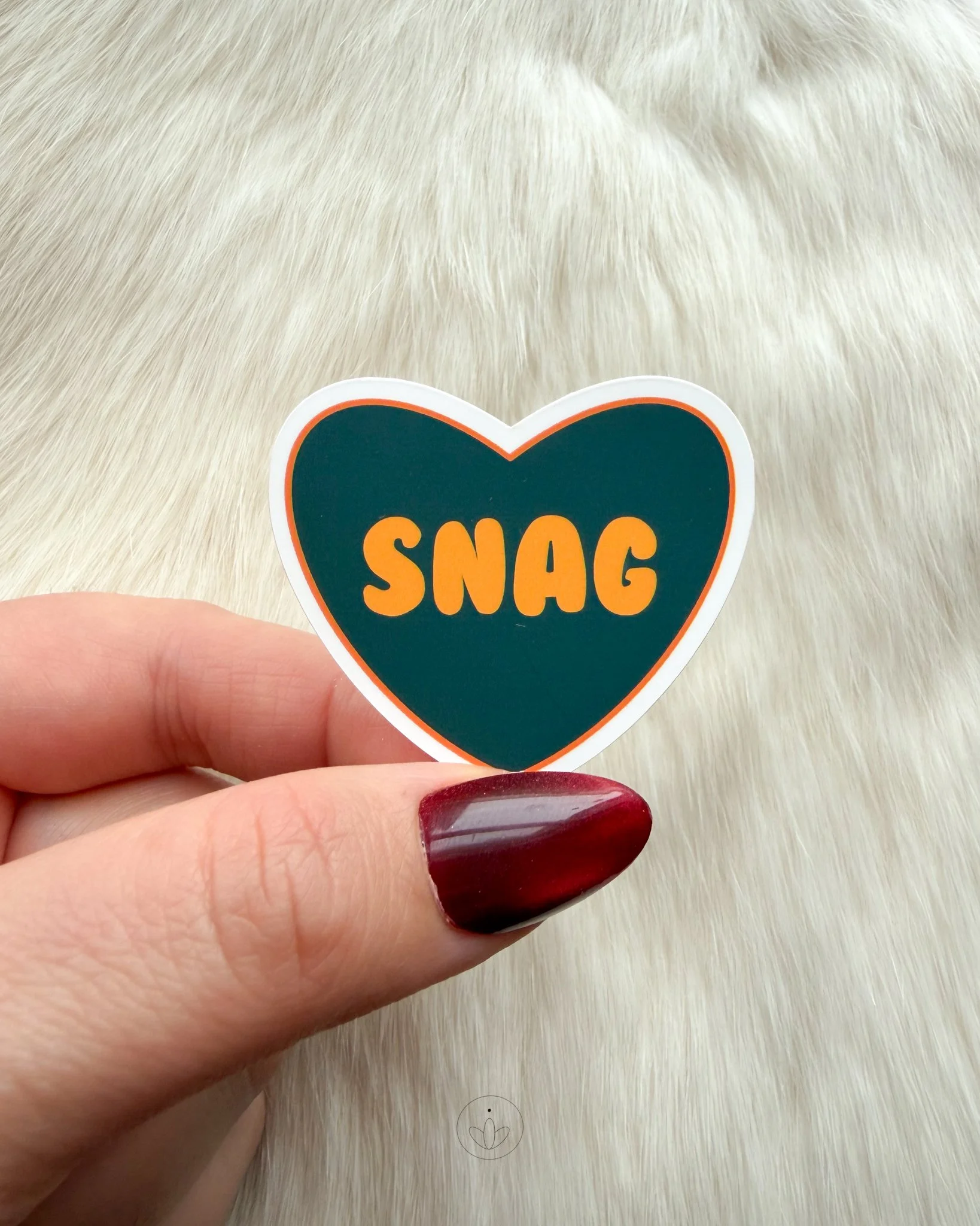 dark blue and orange snag sticker.jpg