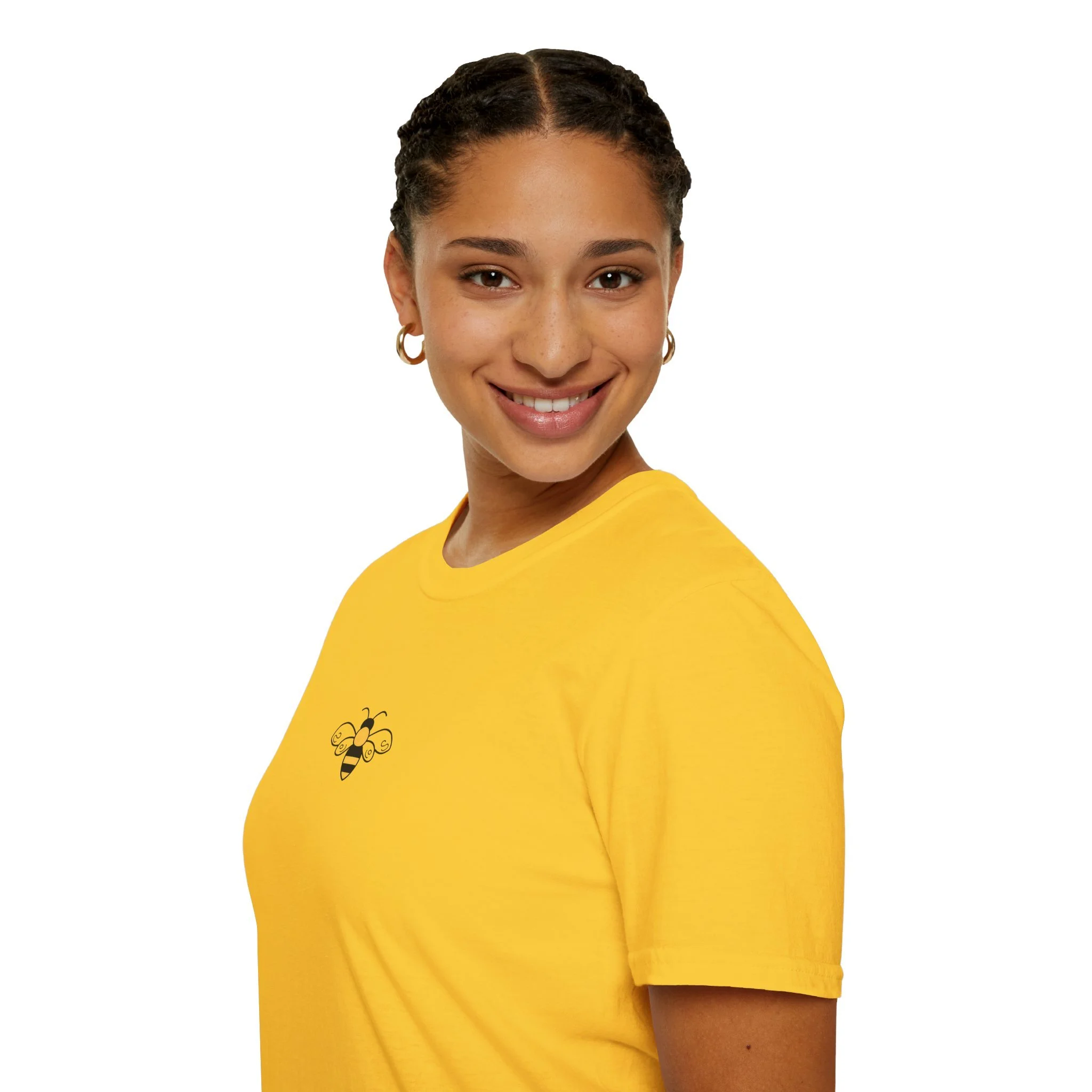 A woman with dark curly hair styled in braids, wearing a yellow shirt with a bee graphic, smiling, with a white background.