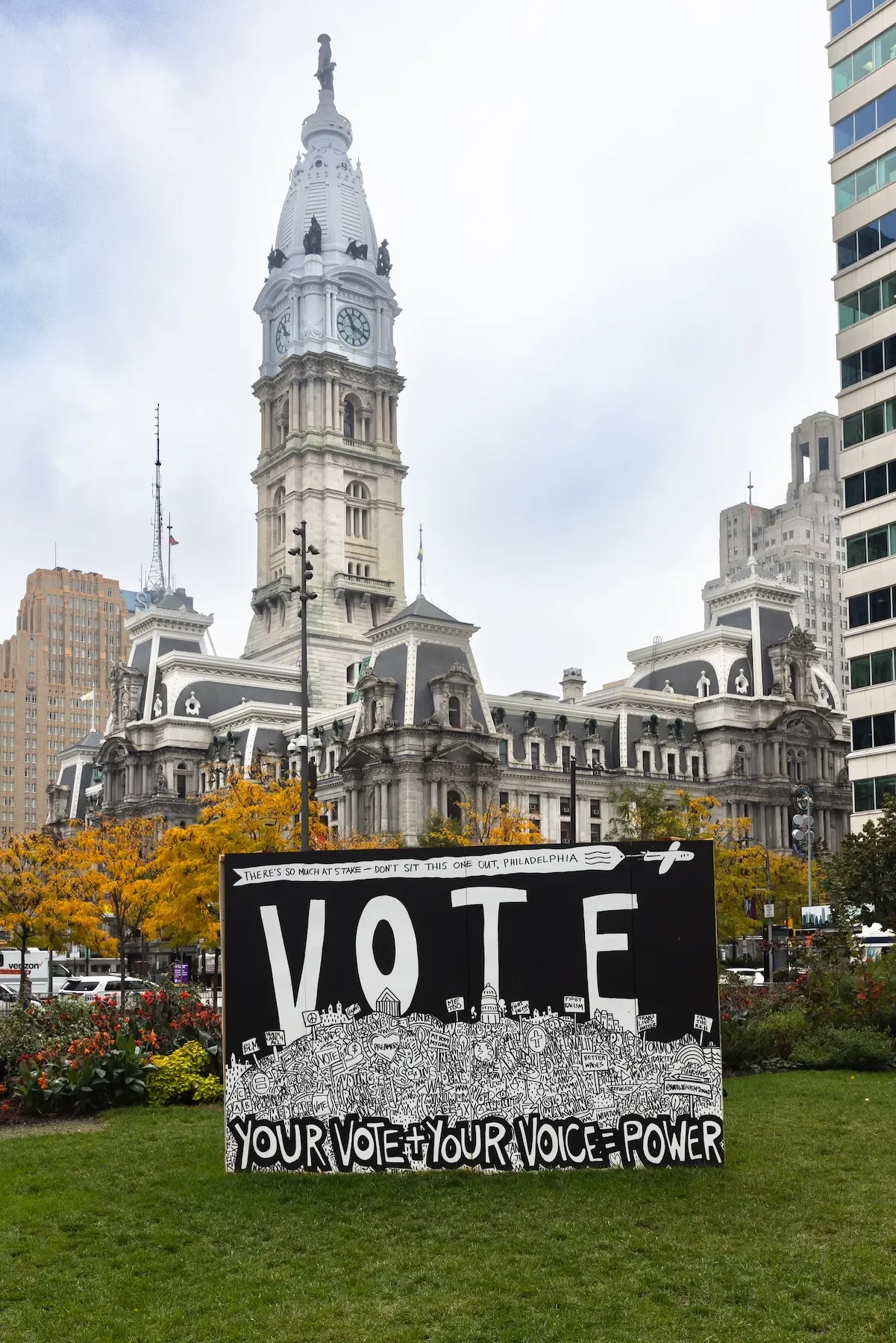 To the Polls was a temporary exhibit hosted by Mural Arts Philadelphia and Streets Dept Walls in LOVE Park on public view October 25-November 4, 2022. Six 8×12-foot geometric panels held the work of De’von Downes, Donna Grace Kroh, Frank Chappell III