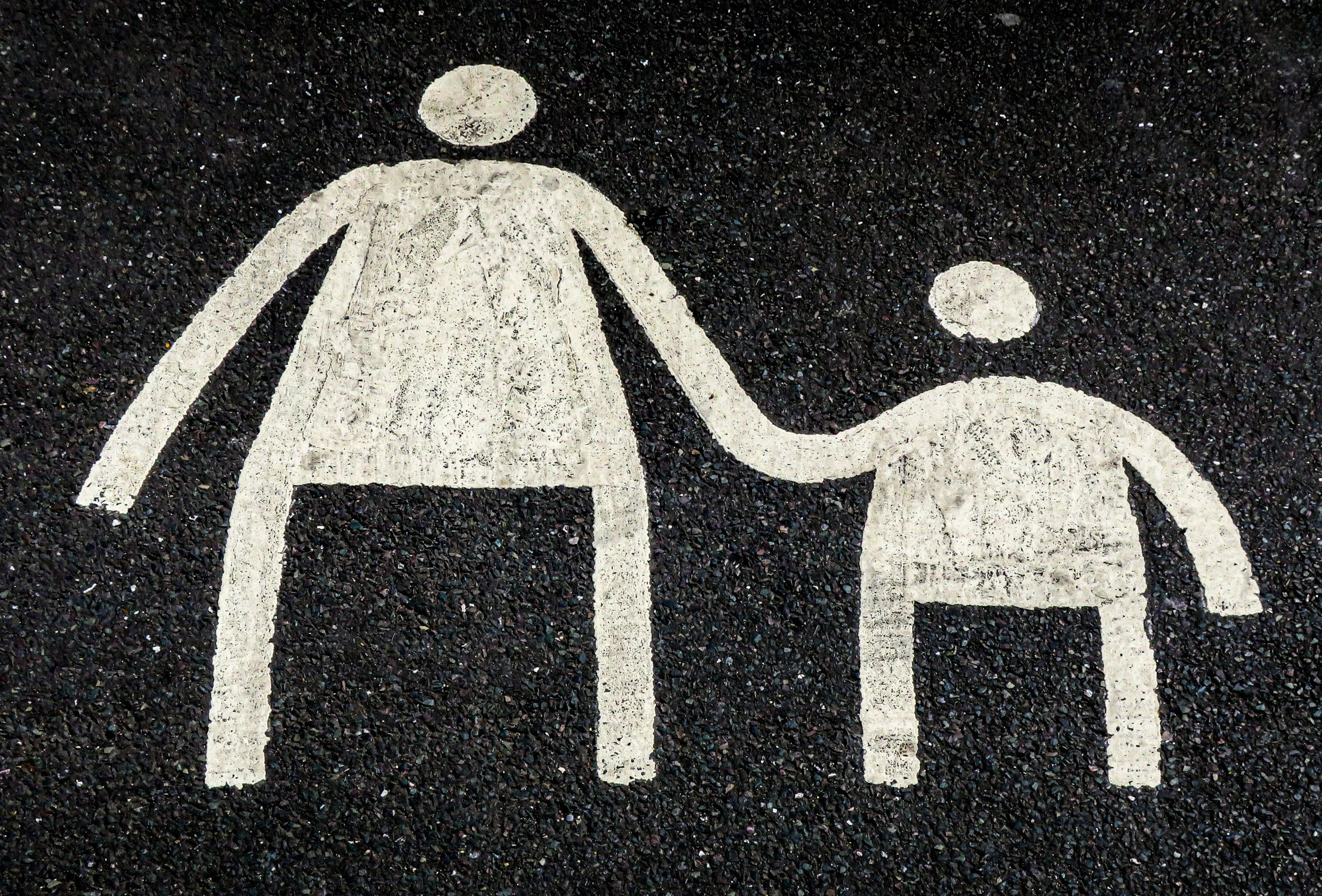 Parent holding child’s hand representing secure attachment healing through IFS therapy in Portland, Oregon