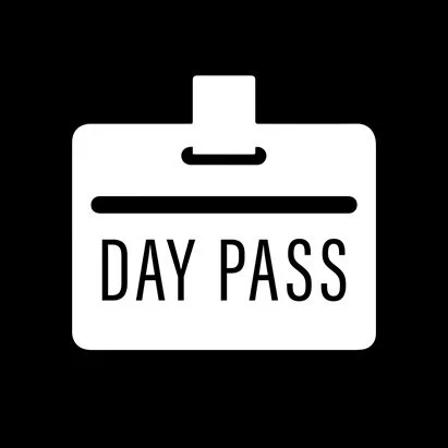 Icon of a white pass with the words 'DAY PASS' on a black background.