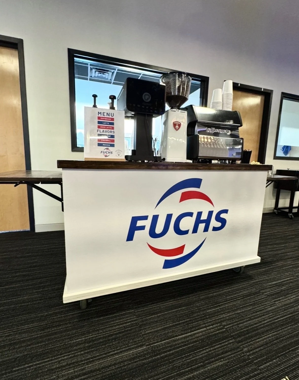 Custom branded espresso cart with FUCHS logo for corporate grand opening event in Taunton, MA