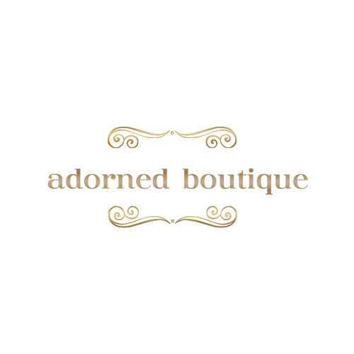Logo with ornamental gold flourishes and the text 'adorned boutique' in lowercase letters.