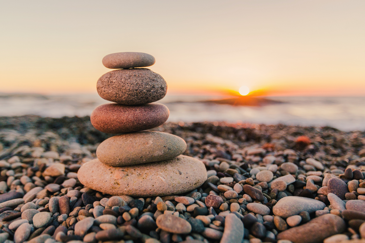 Cairn stones on the edge of a beach.