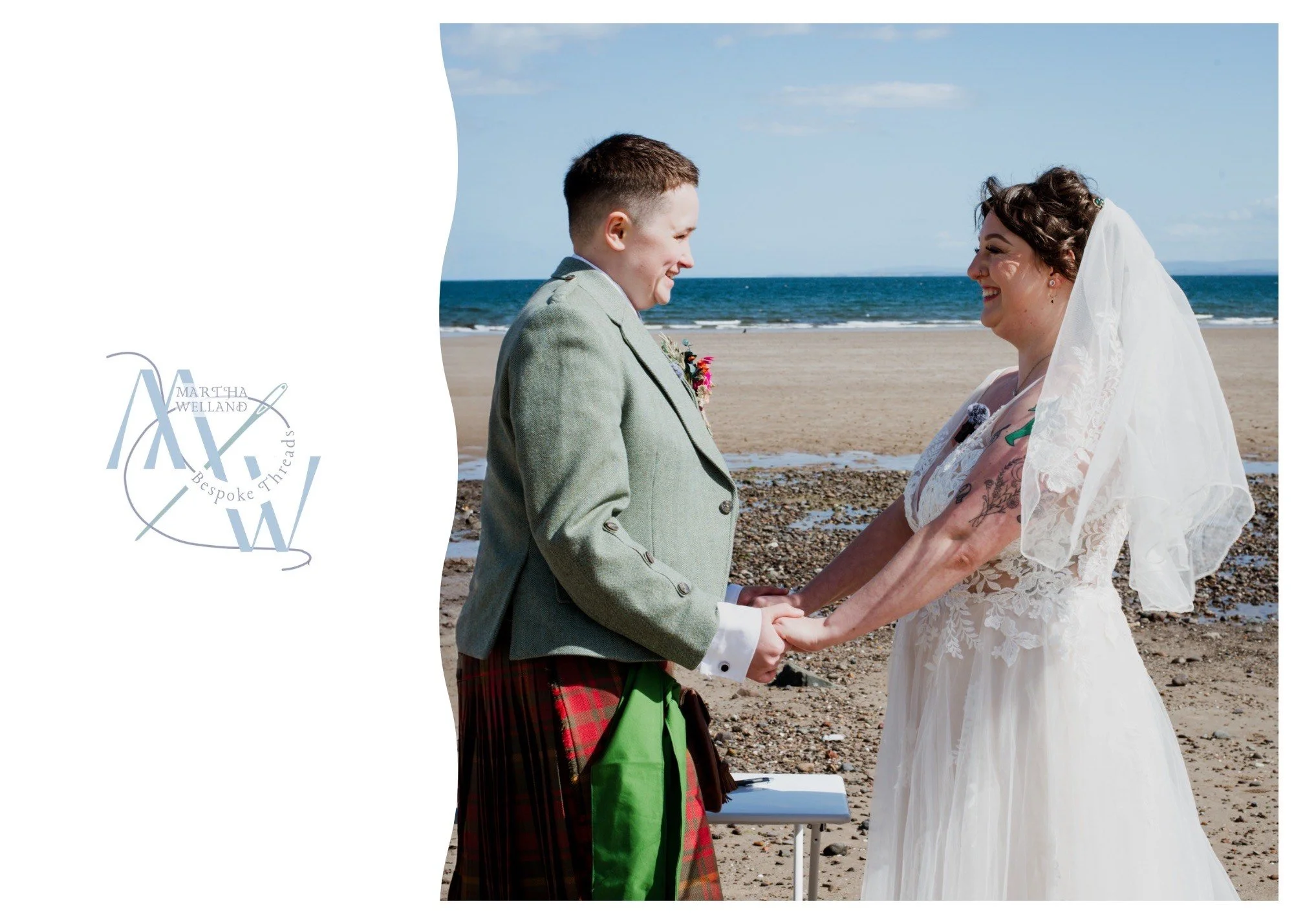 A bride and groom holding hands and smiling at each other during their wedding ceremony on a beach, with ocean and sky in the background.