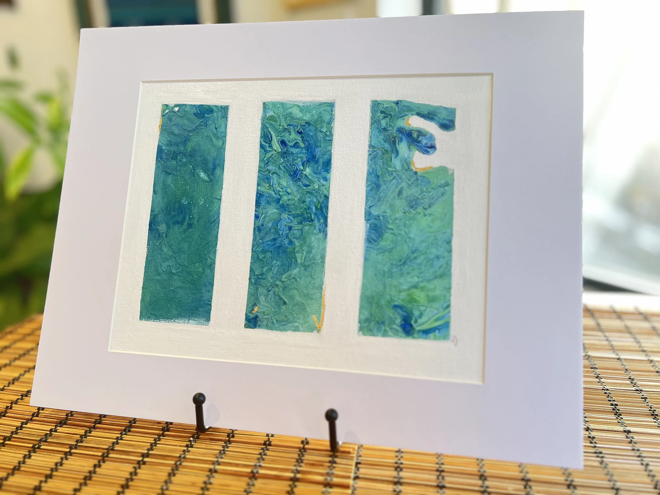 Love, deep like the ocean, flows with currents unseen, vast and mysterious. The gold leafing that subtly spells out “love” is like a hidden treasure, glimmering beneath the waves. Some hold it tightly, clinging to its radiance, while others embark on