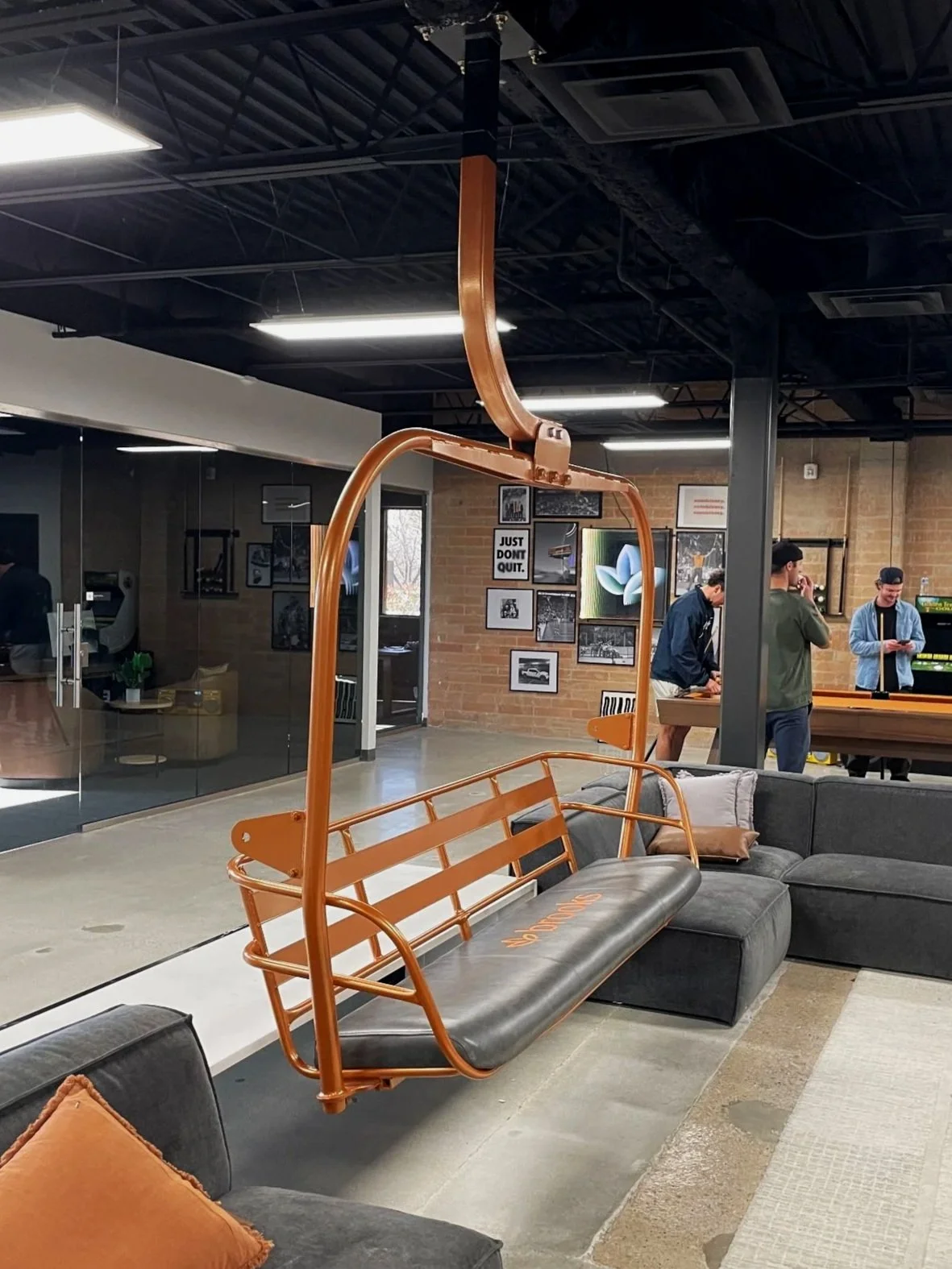 Refurbished Vintage Ski Lift Chair, powder-coated orange with a custom leather embroidered seat.