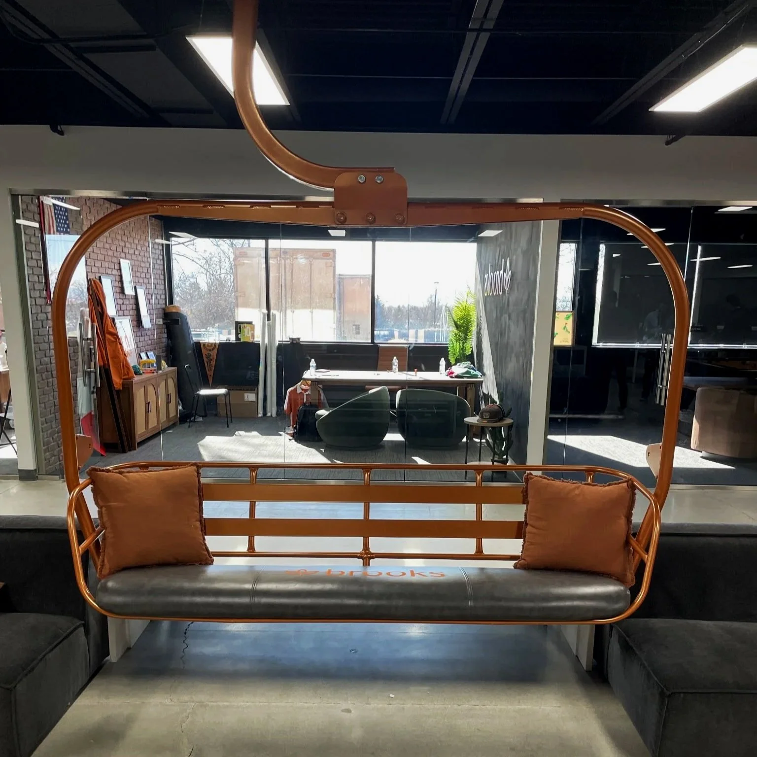 Refurbished Vintage Ski Lift Chair, powder-coated orange with a custom leather embroidered seat.
