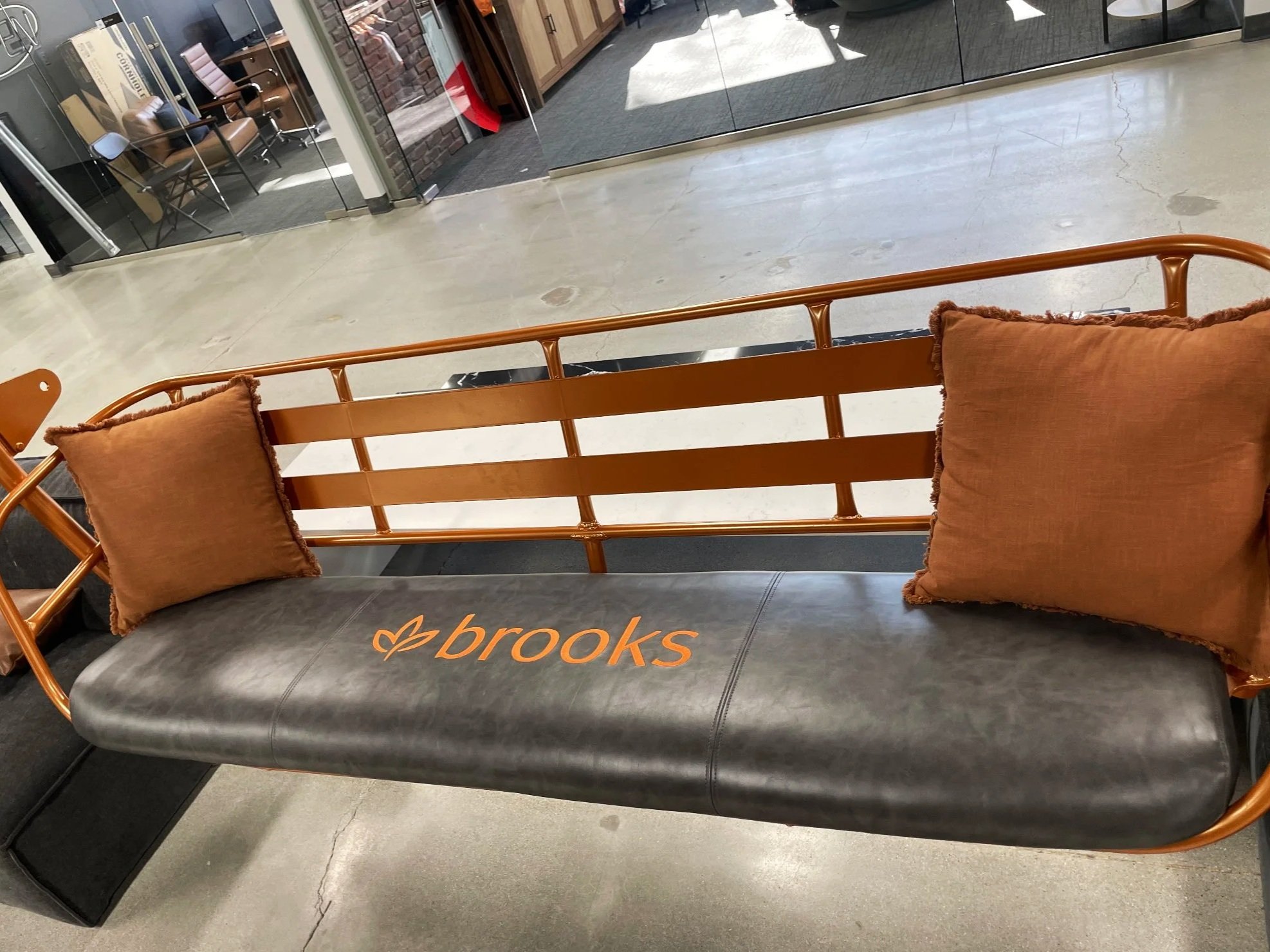 Refurbished Vintage Ski Lift Chair, powder-coated orange with a custom leather embroidered seat.