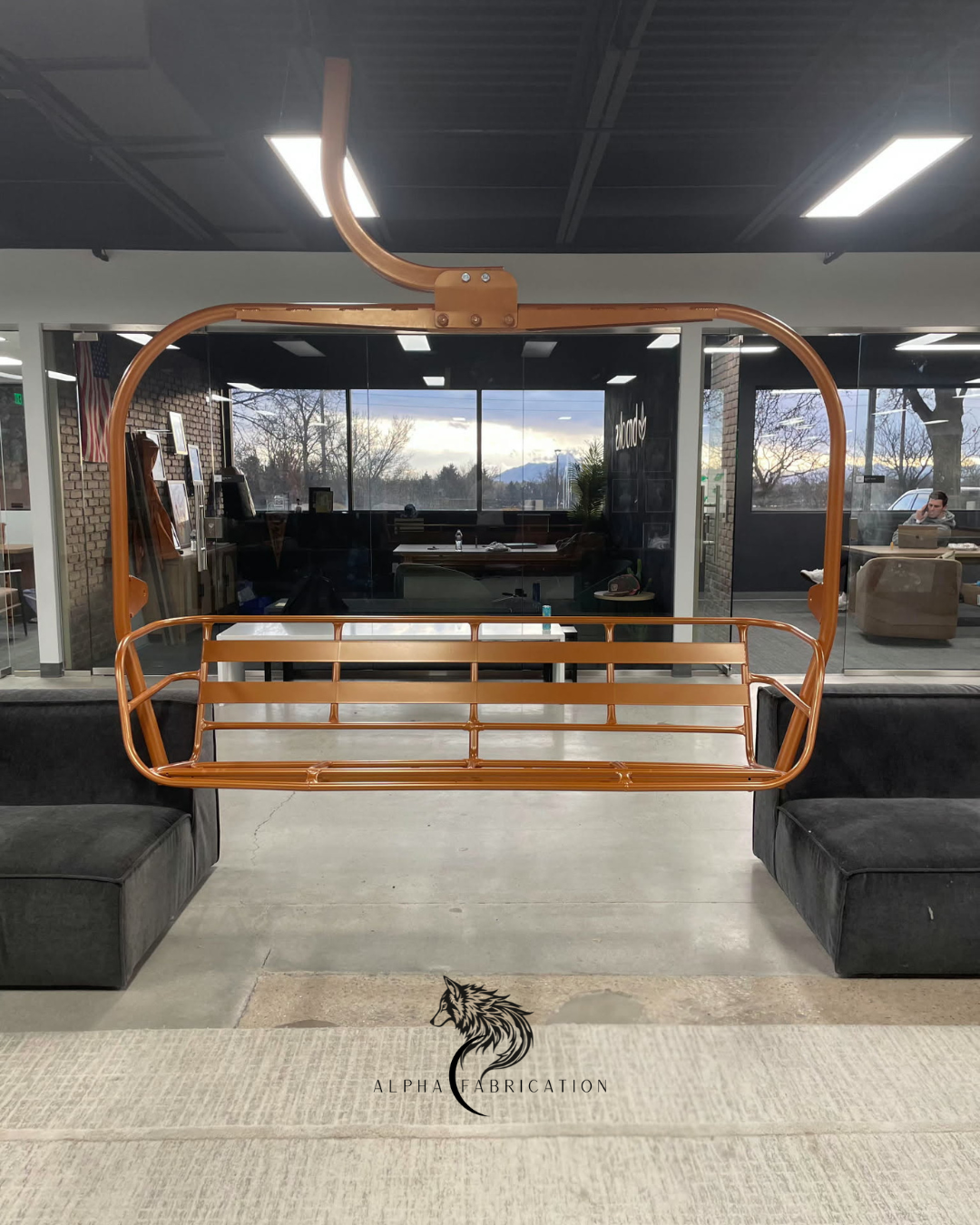 Refurbished Vintage Ski Lift Chair, powder-coated orange.