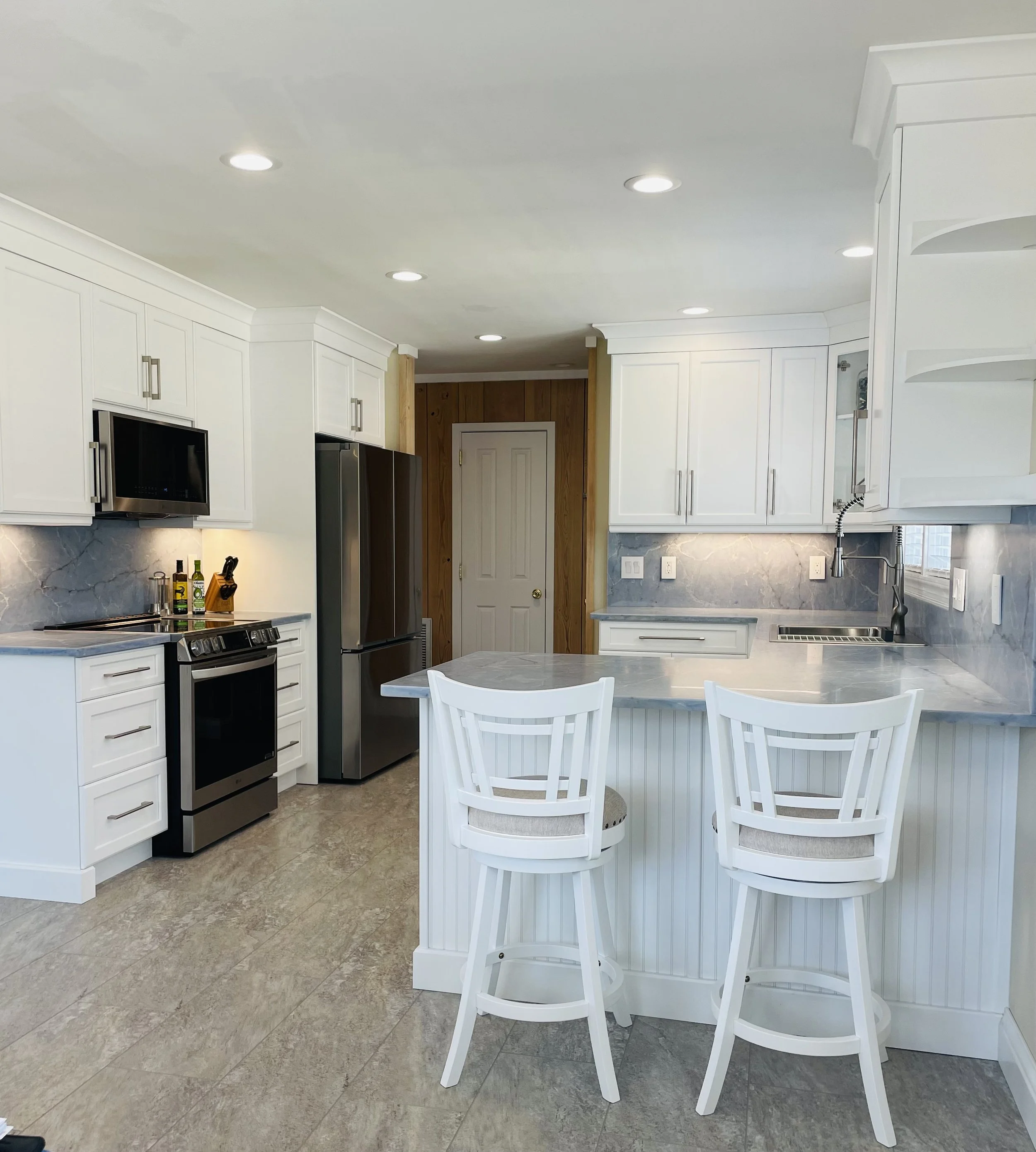 Full kitchen both sides with bar stools.jpeg