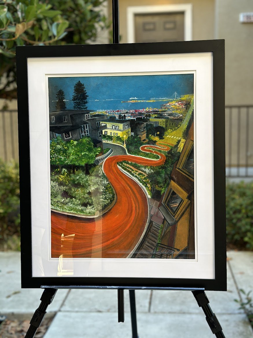 “A colorful and dynamic portrayal of San Francisco’s iconic Lombard Street. The winding red road leads the eye through lush greenery, charming homes, and out toward the sparkling bay, capturing the city’s unique blend of energy and beauty.” - paintin