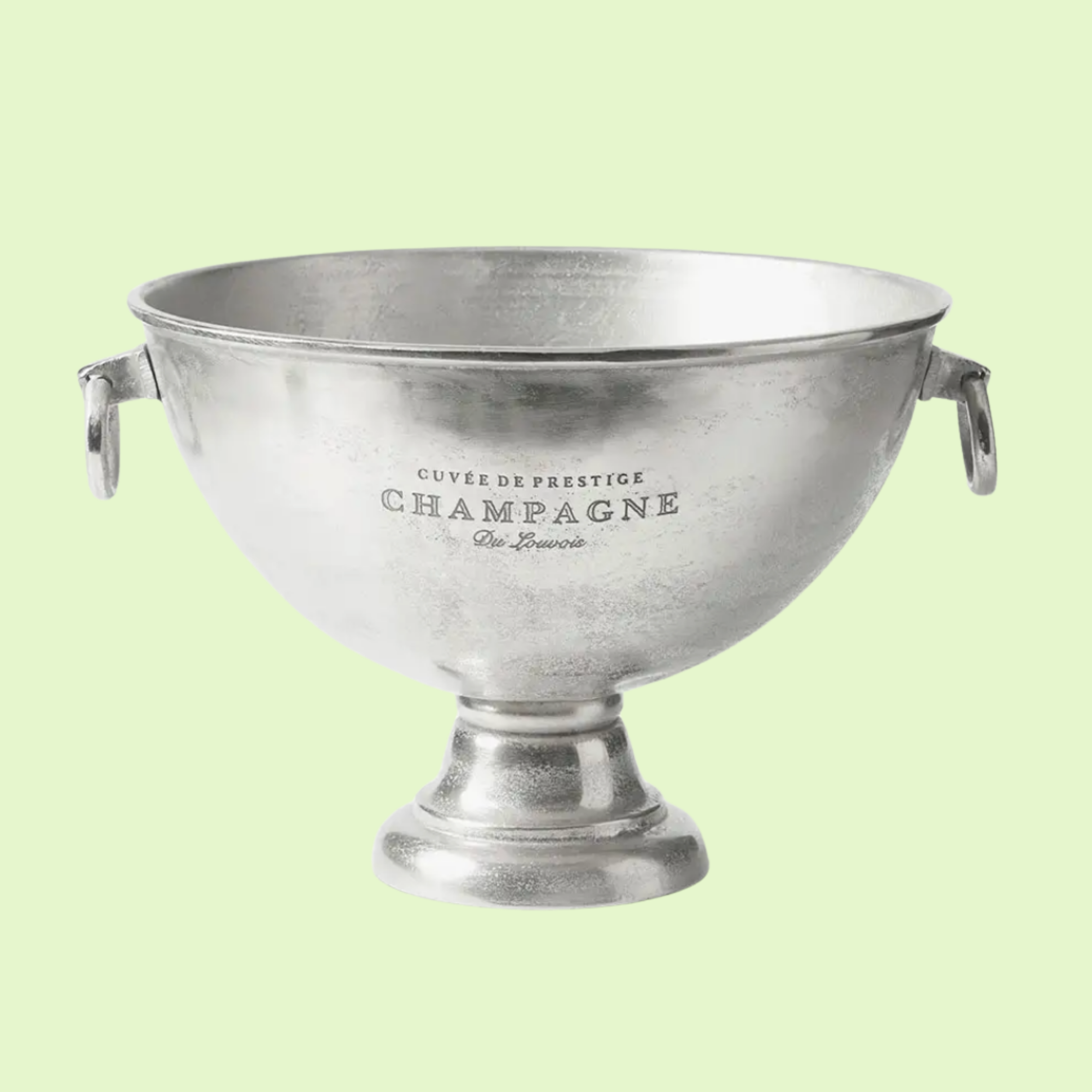 Silver champagne cup with engraved text, handles on each side, set against a light green background.
