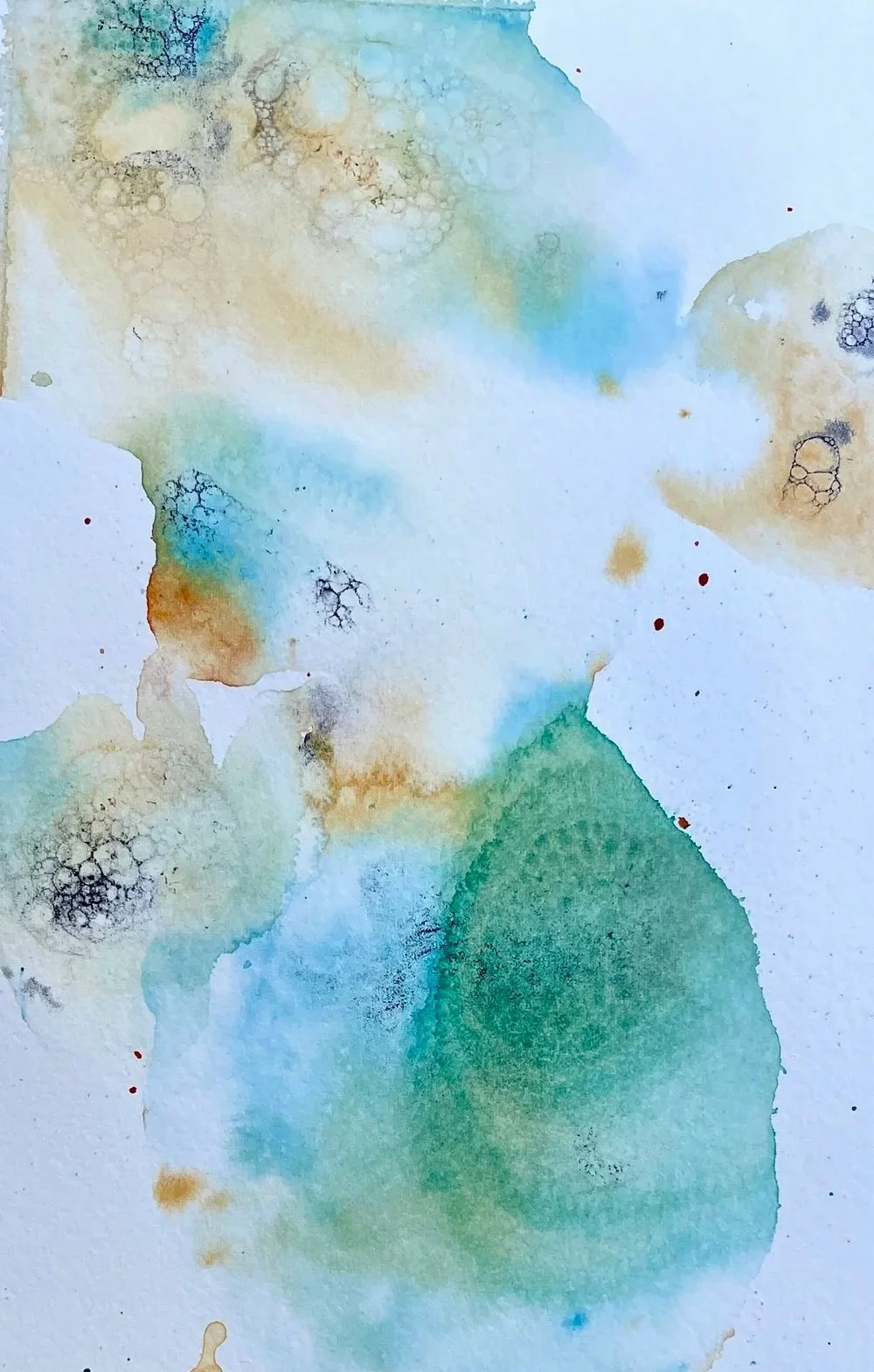 Abstract watercolor painting with soft pastel colors including blue, green, yellow, and brown, featuring circular and organic shapes with some black outlines and splashes.