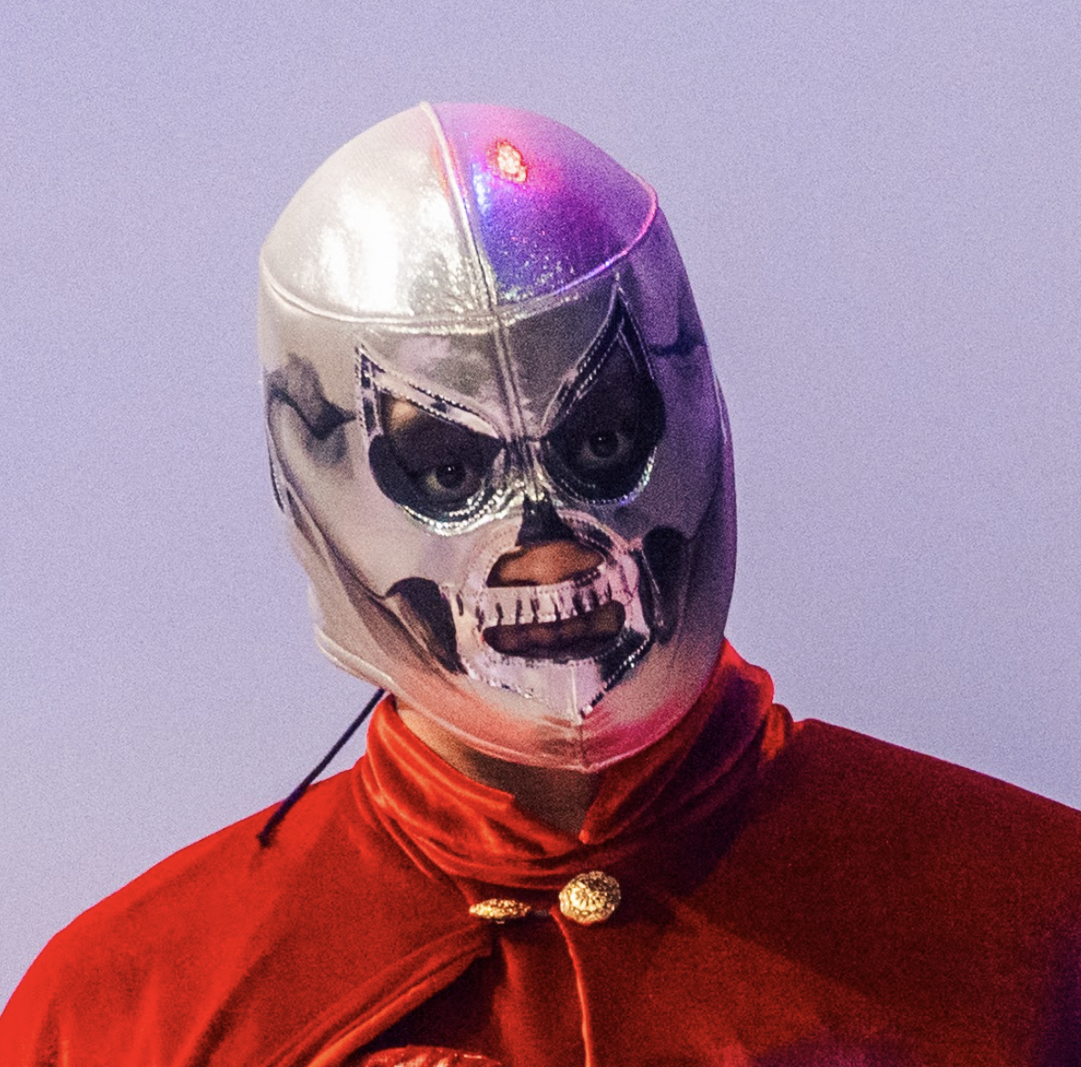 Silver Luchador mask painted with black fabric paint to resemble a skull.