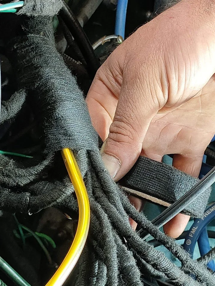 Wrapping a wiring loom after repairs 