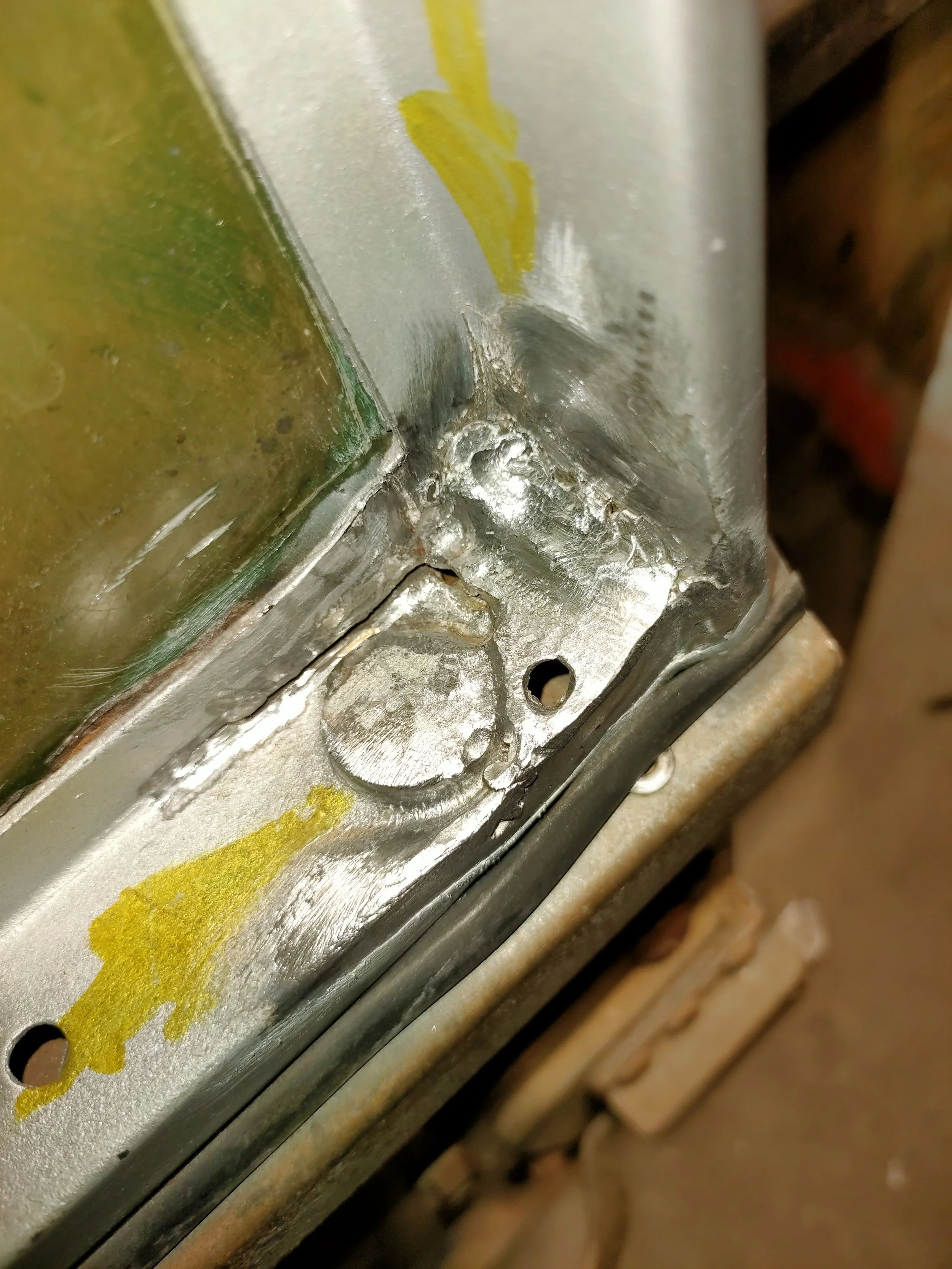 Weld repairs to a Series door top panel