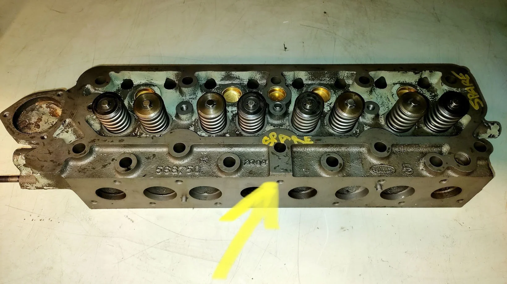 Late Series 2a or Series 3 2.25 petrol cylinder heads (distinguishable by the raised boss, arrowed in the photo above). They usually have the casting number 568750.