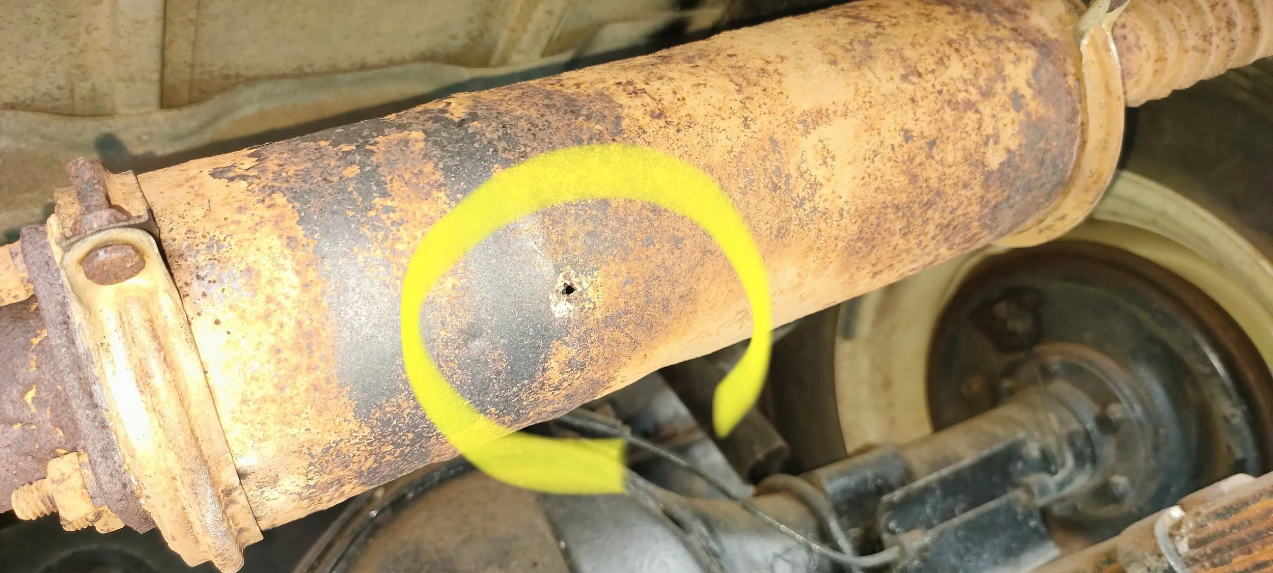 A roadworthy baseline inspection found a pinhole in the muffler 