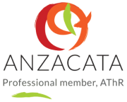 Logo of an organization with a stylized red and orange circular design and text 'ANZ' and 'TA' beneath it.