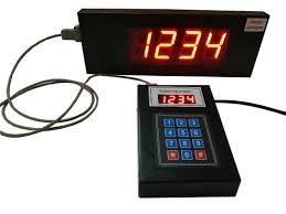 Digital countdown timer displaying 1234, connected to a control device with a keypad