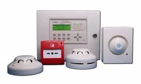 A fire alarm system with a control panel, smoke detectors, a manual pull station, and a siren speaker.