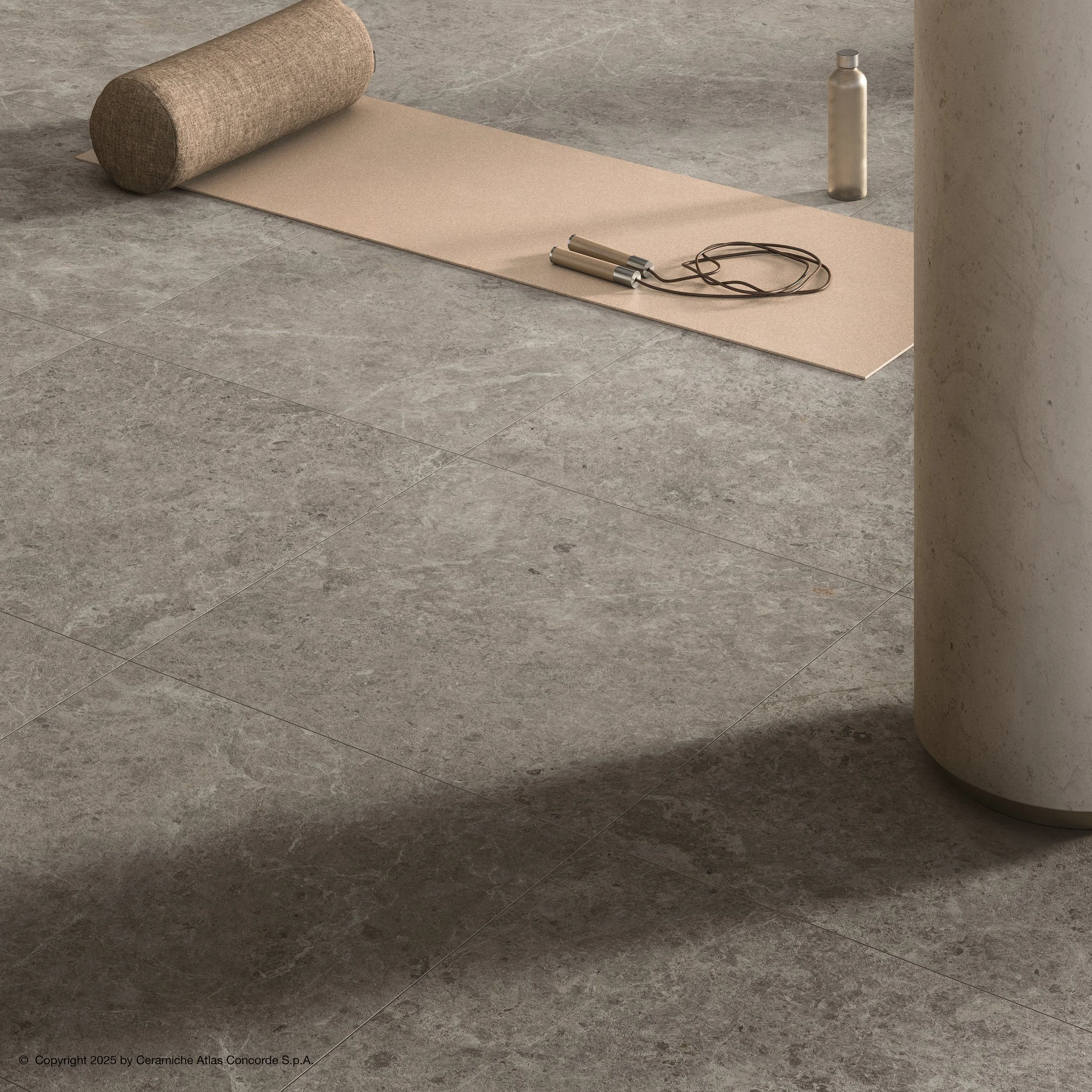 ruskeanharmaa lattialaatta jossa eläväinen pinta ja tekstuuria.