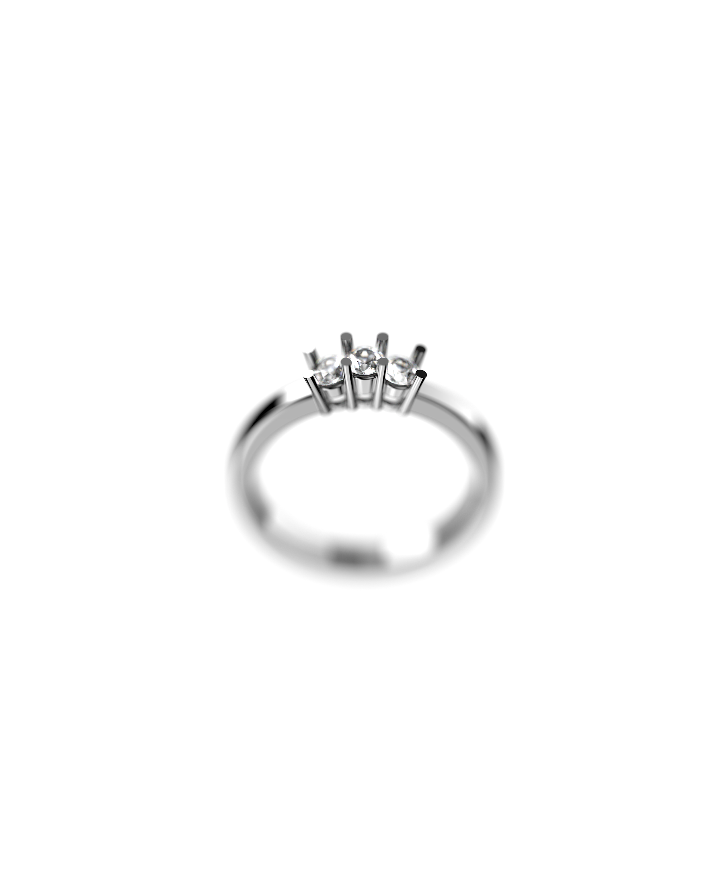 Anello con cinque diamanti incastonati in una fila su una superficie bianca