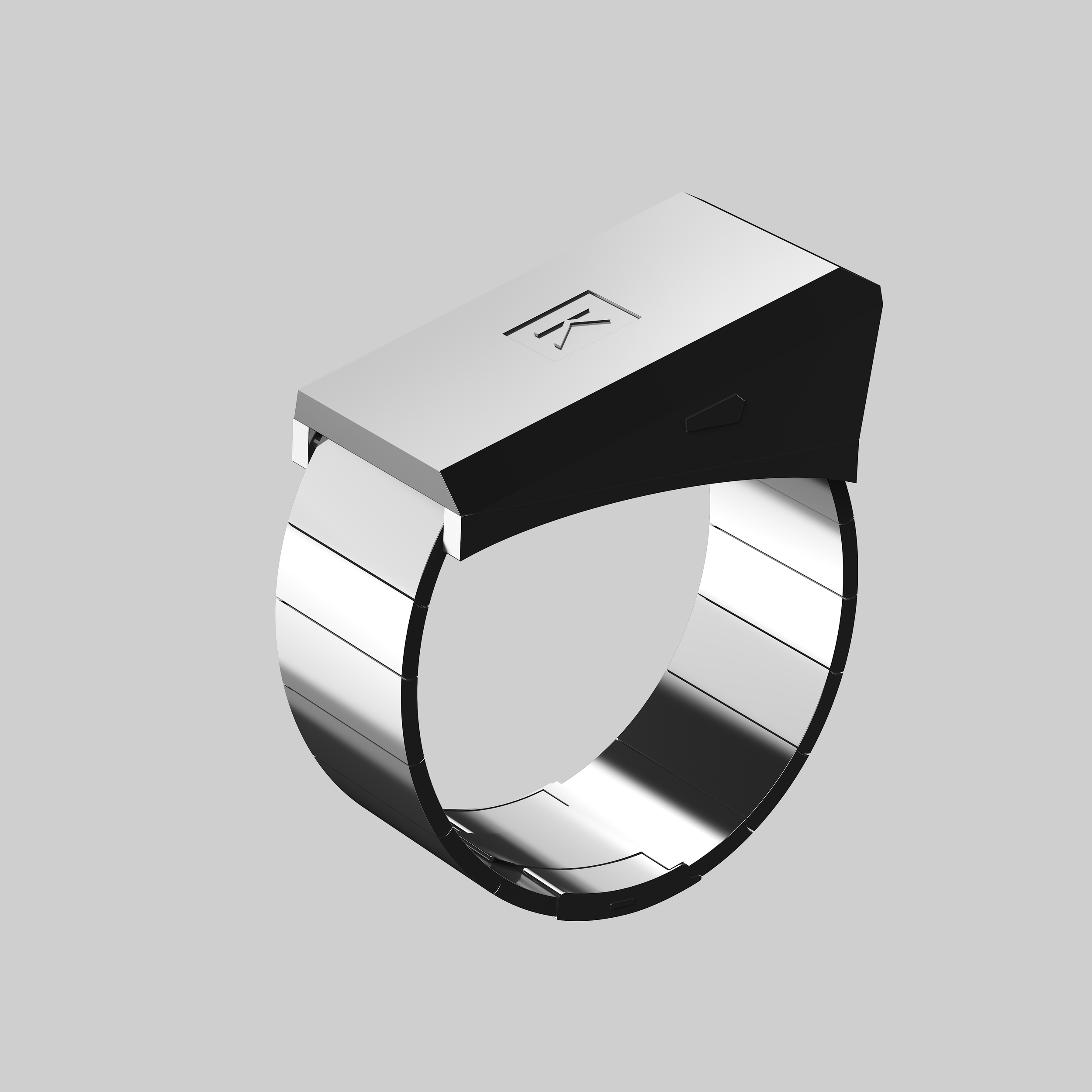 Anello di forma rettangolare con superficie metallica e cinturino in metallo a schede